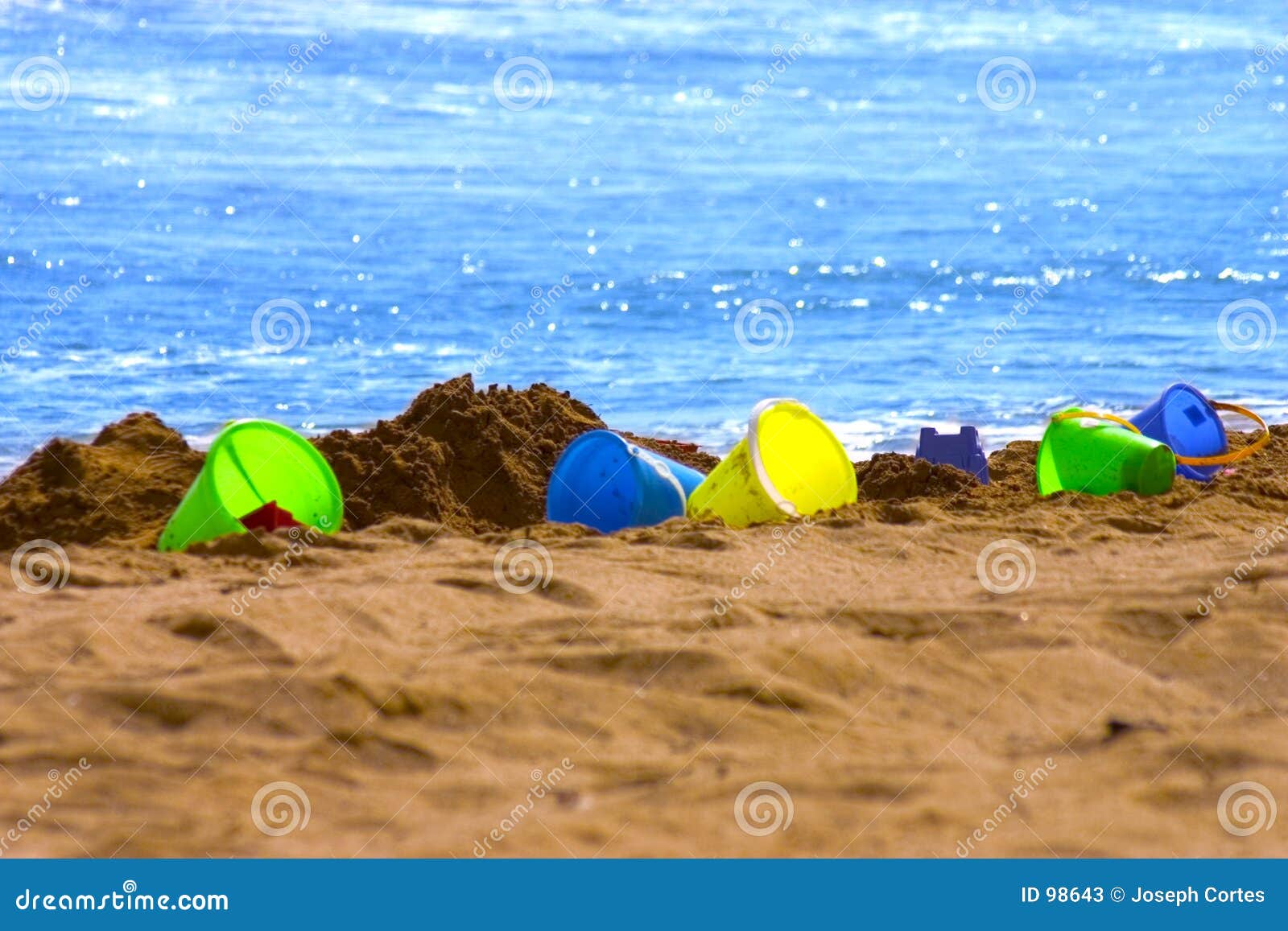 Colorful Sand buckets stock image. Image of sand, wave, game 98643