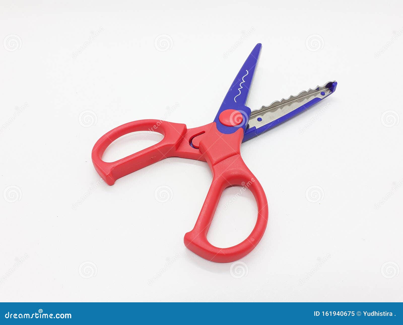 Colorful Scissor That Cut A Zigzag Pattern Stock Photo - Download
