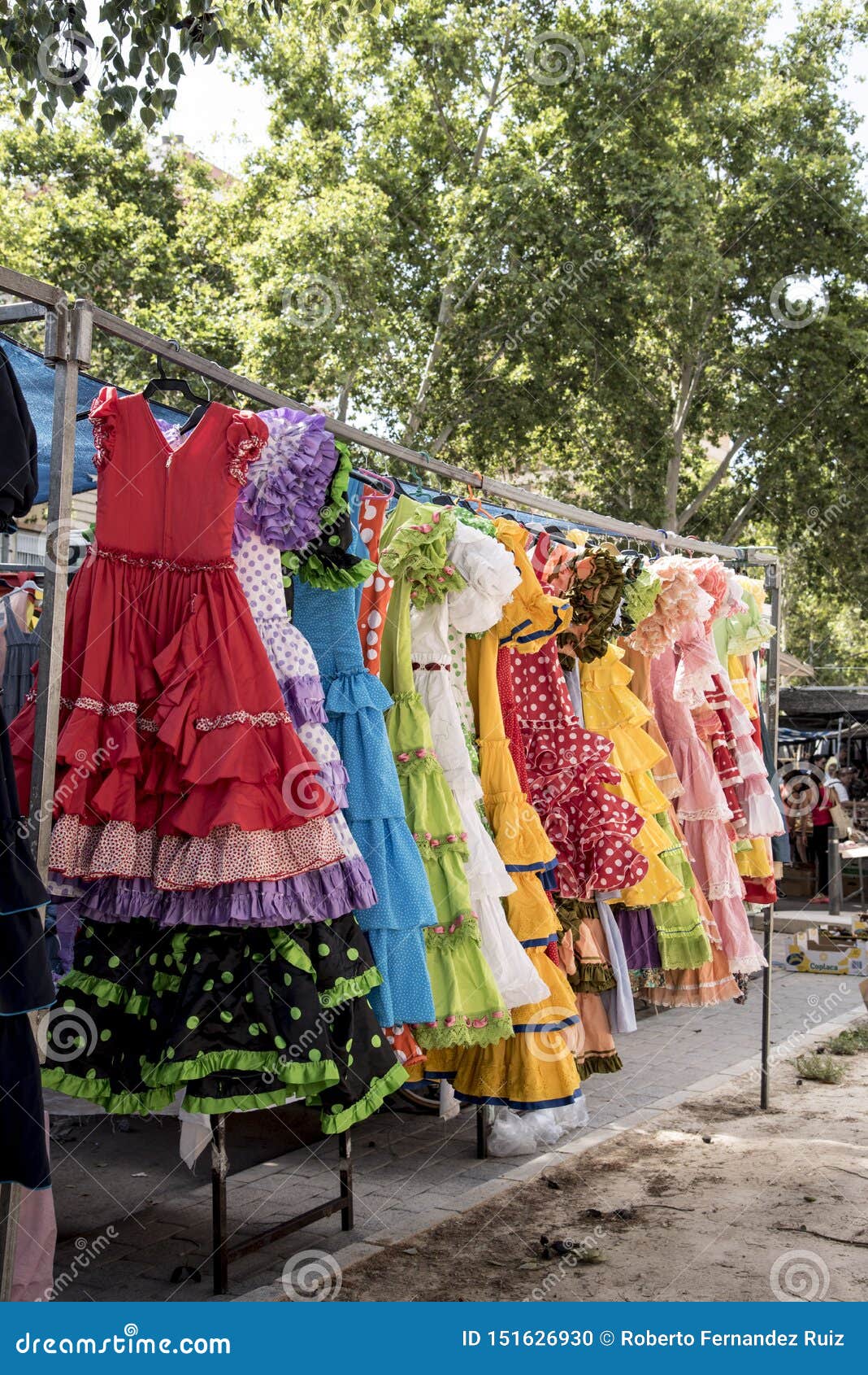 colorful sevillana costumes at a street market in spain