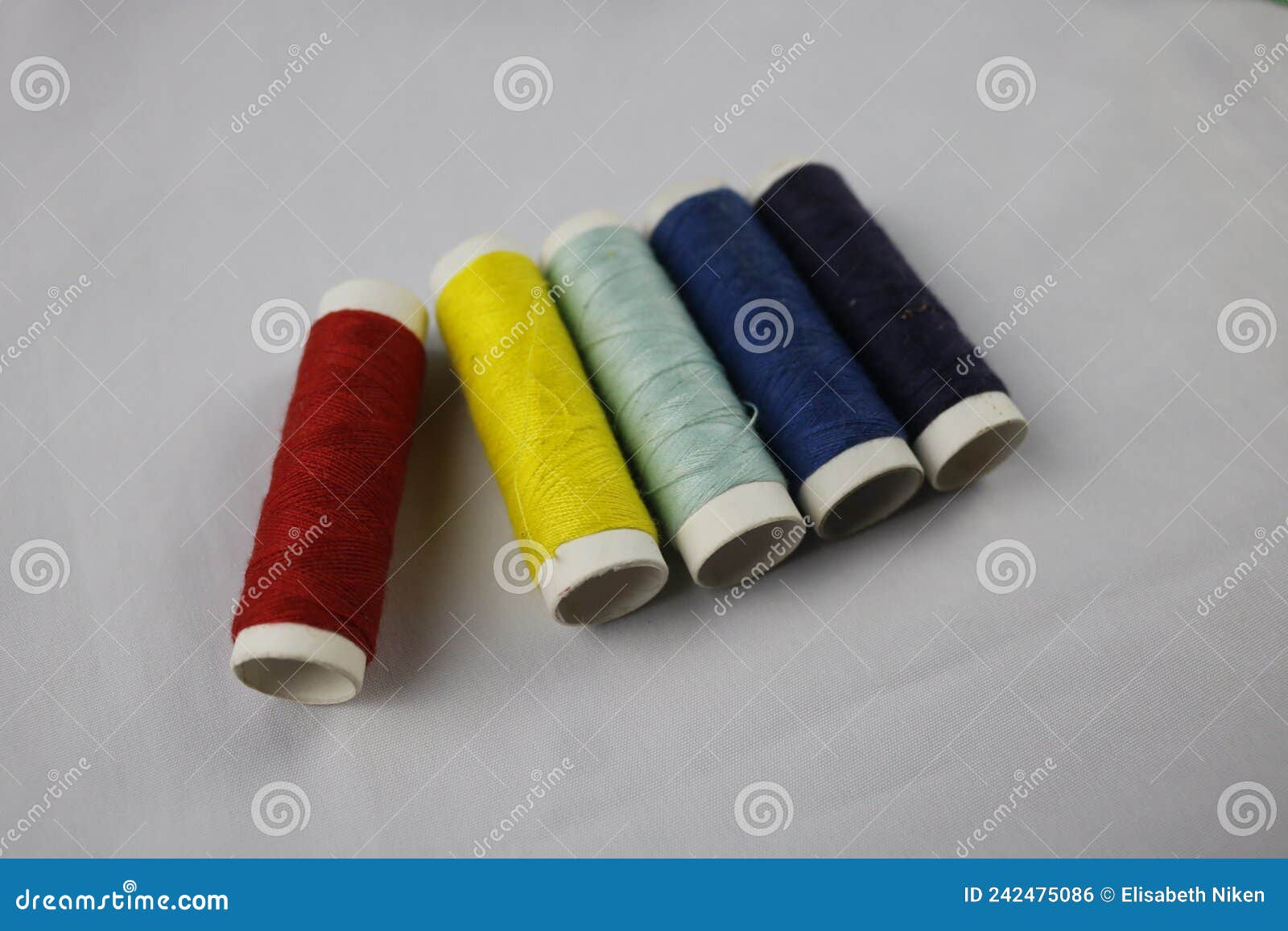 Colorful sewing thread stock photo. Image of branding - 242475086