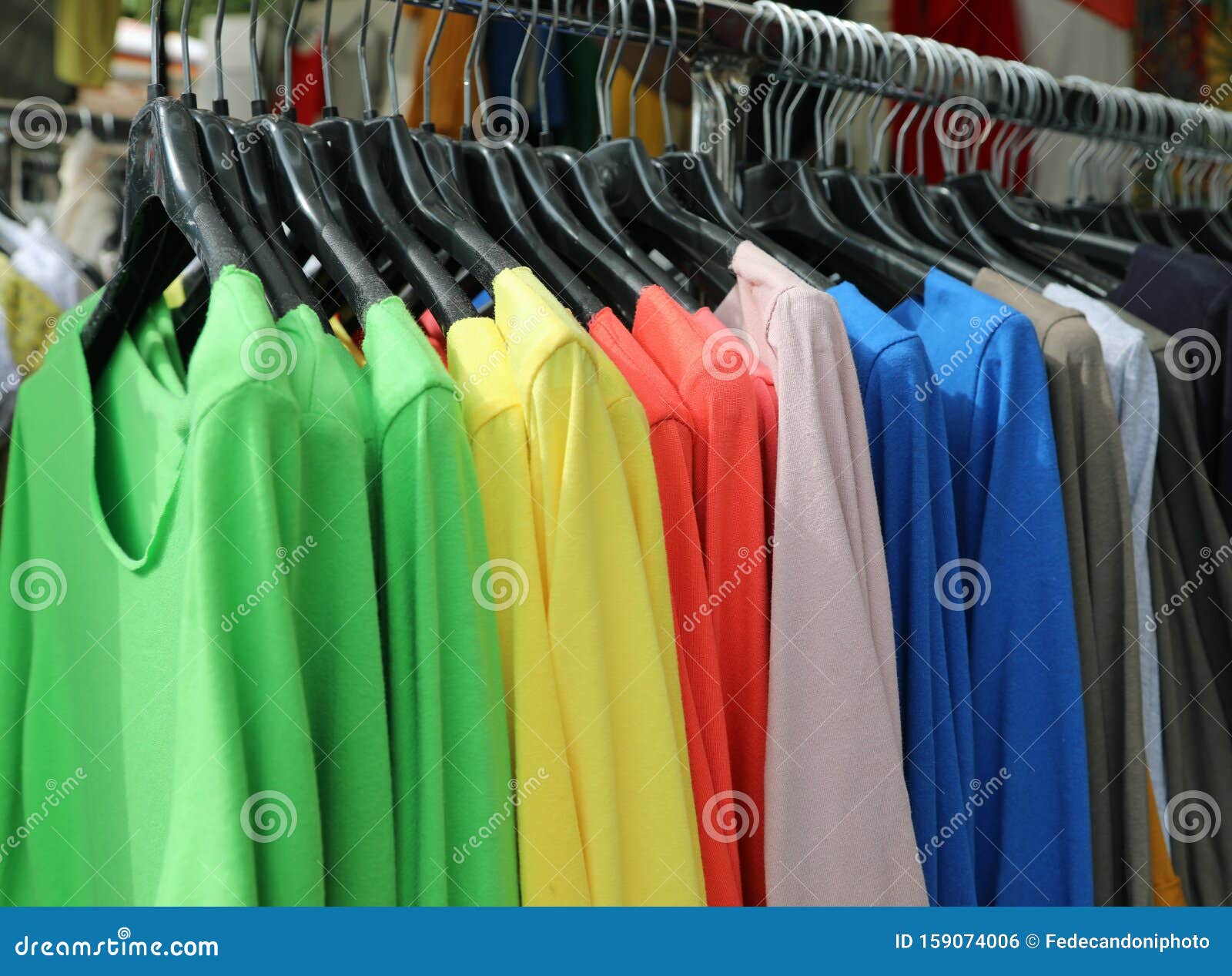 Colorful Shirts Hanging on the Hanger for Sale in the Shop Stock Photo ...