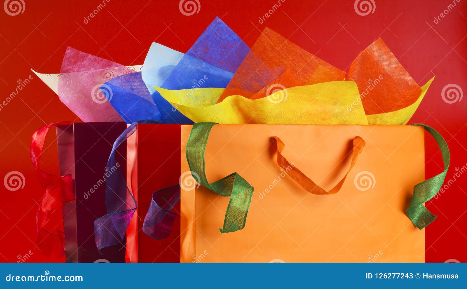 Colorful Shopping Bags with Colorful Wrapping Papers and Ribbons Stock ...