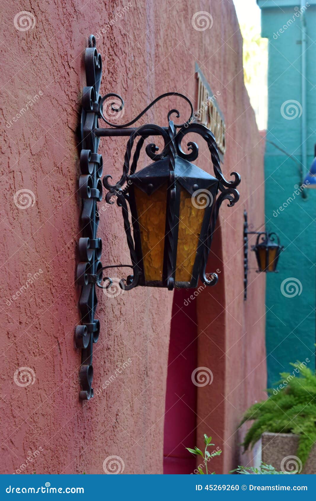 colorful southwest wall with light fixtures