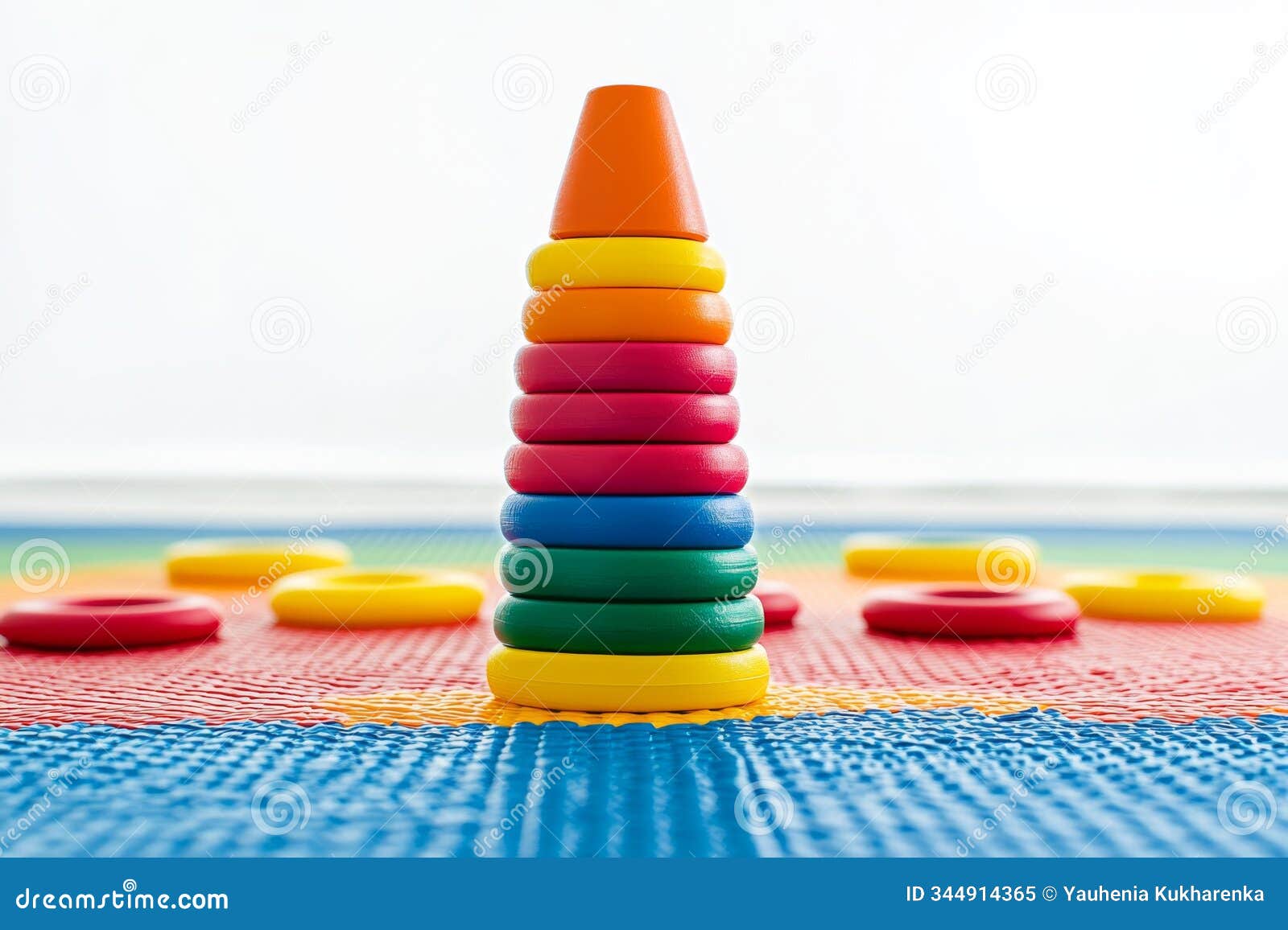 colorful stacking rings on play mat