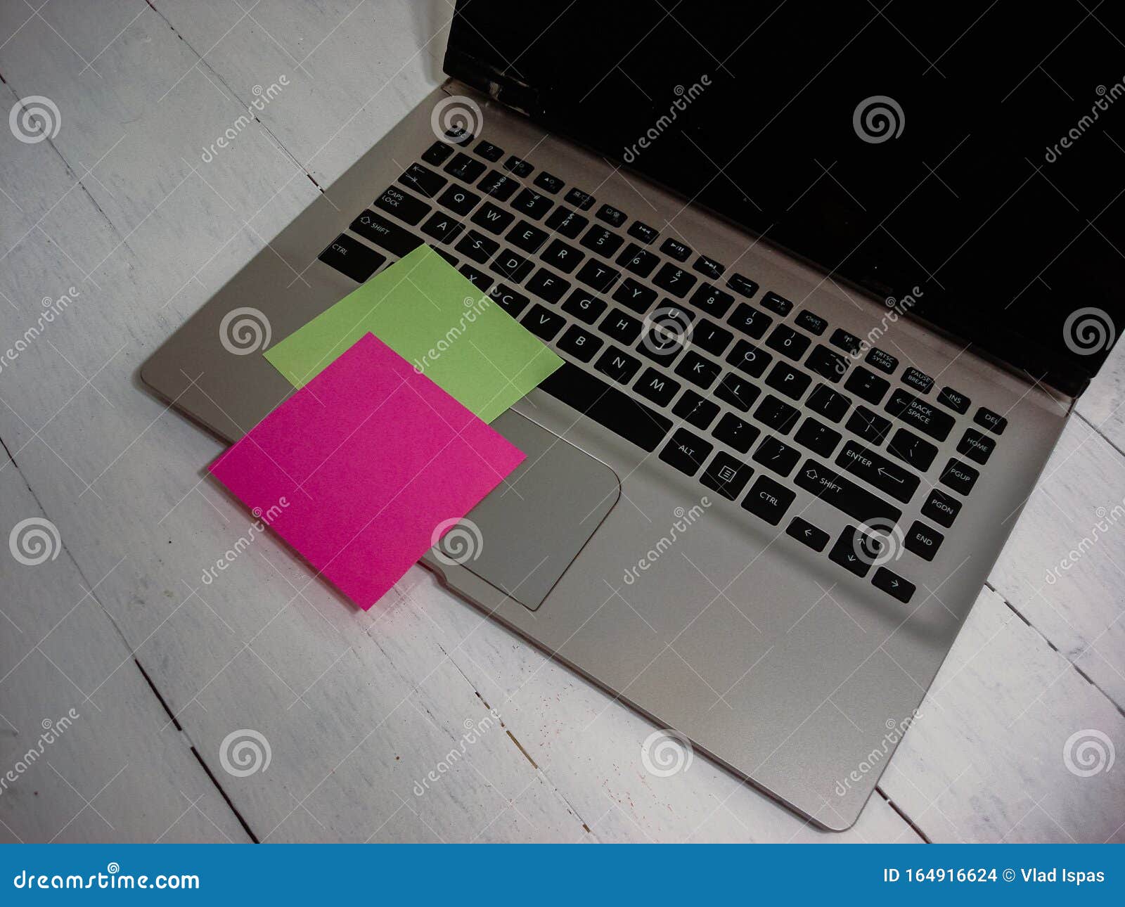 Colorful Sticky Note on Laptop Keyboard. Post it on Keyboard Stock