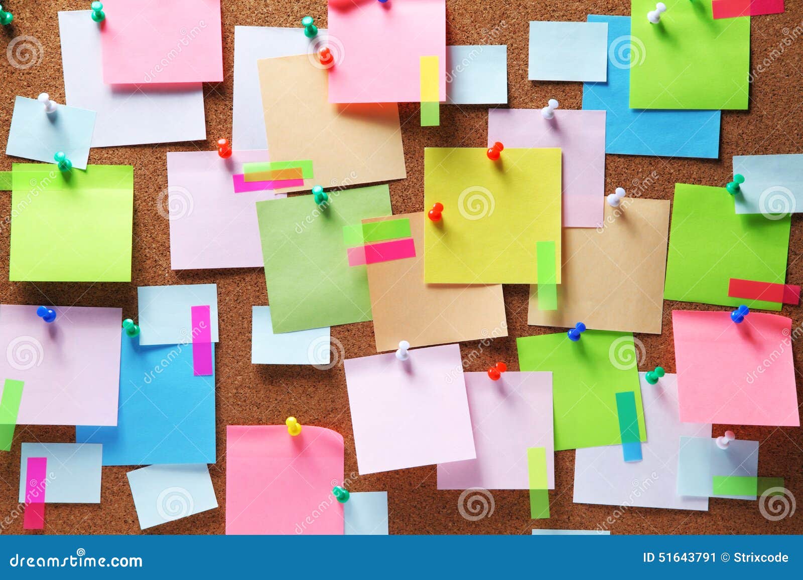 colorful sticky notes on cork bulletin board