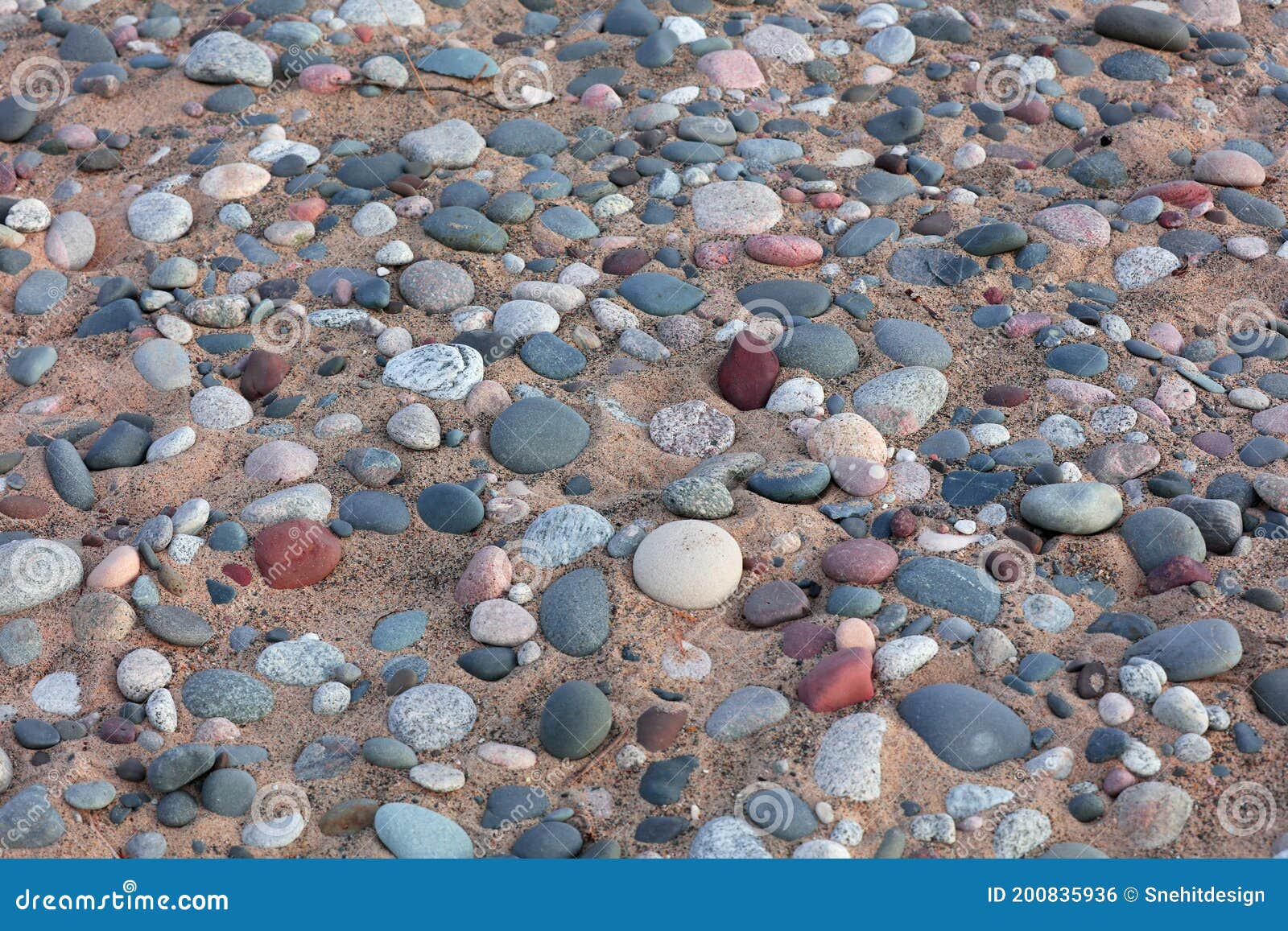 colorful stones embedded in the sand bed