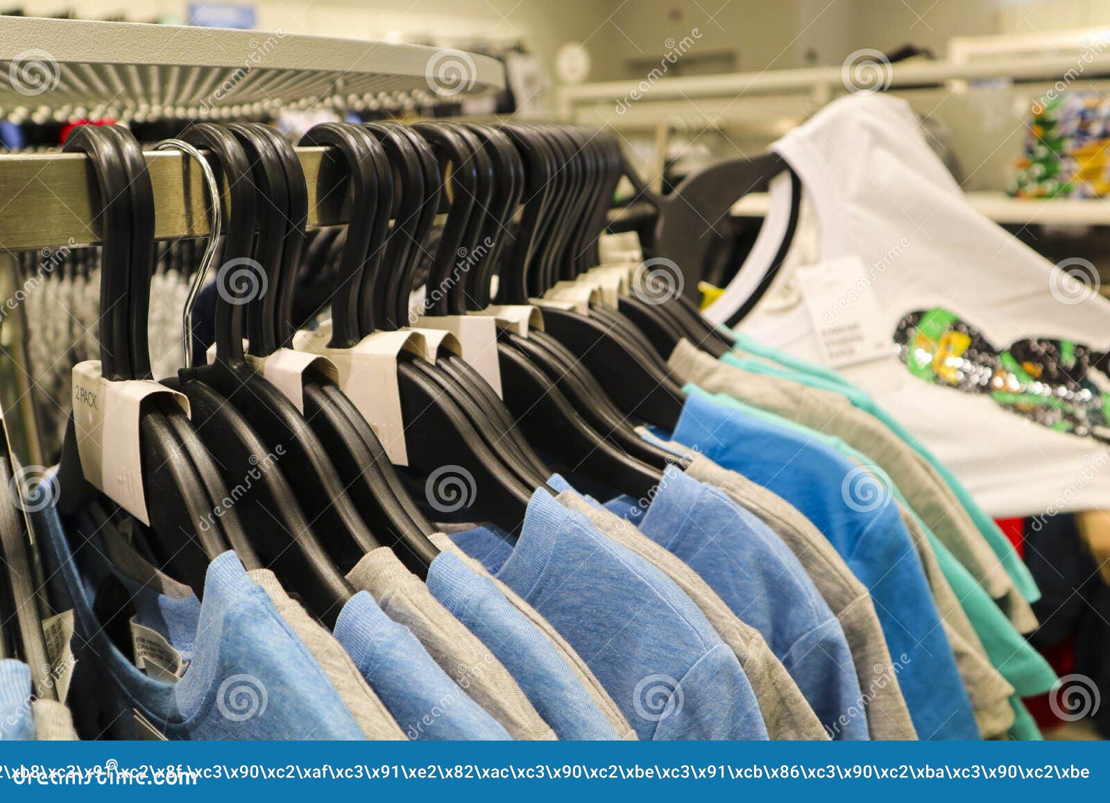 Colorful T-shirts Hang on Hangers in a Clothing Store Stock Photo ...