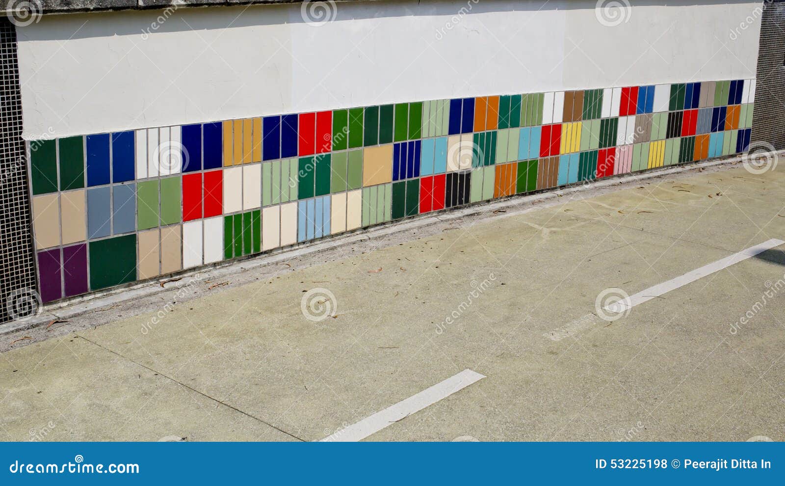 colorful tile of sidewall along a road