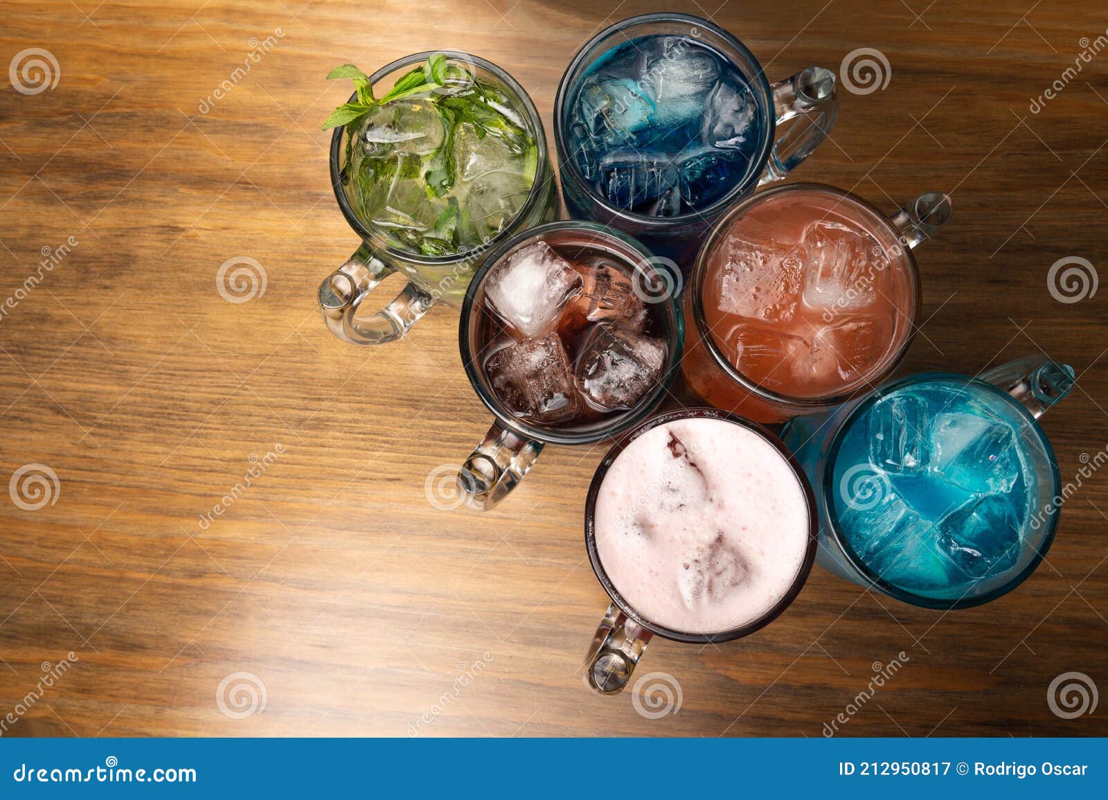 colorful toned cocktails on wooden background. frutal alcoholic cocktails. colorful drinks concept