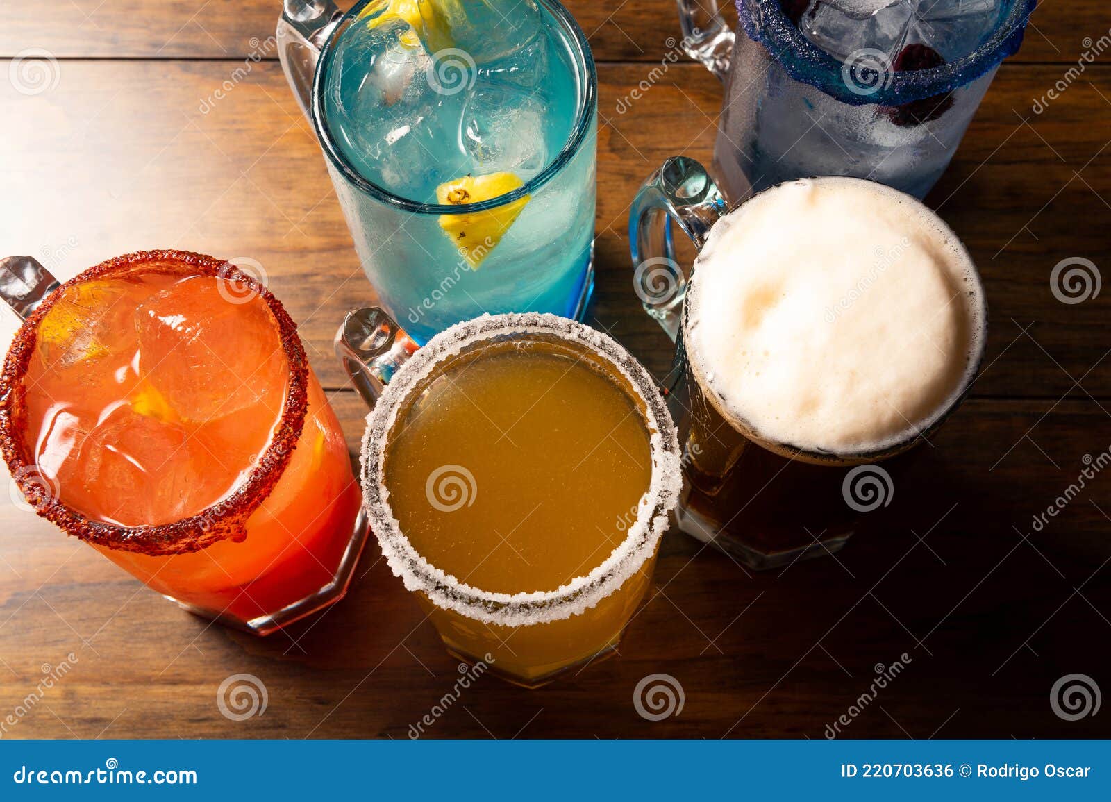 colorful toned cocktails on wooden background. frutal alcoholic cocktails. colorful drinks concept on wooden table