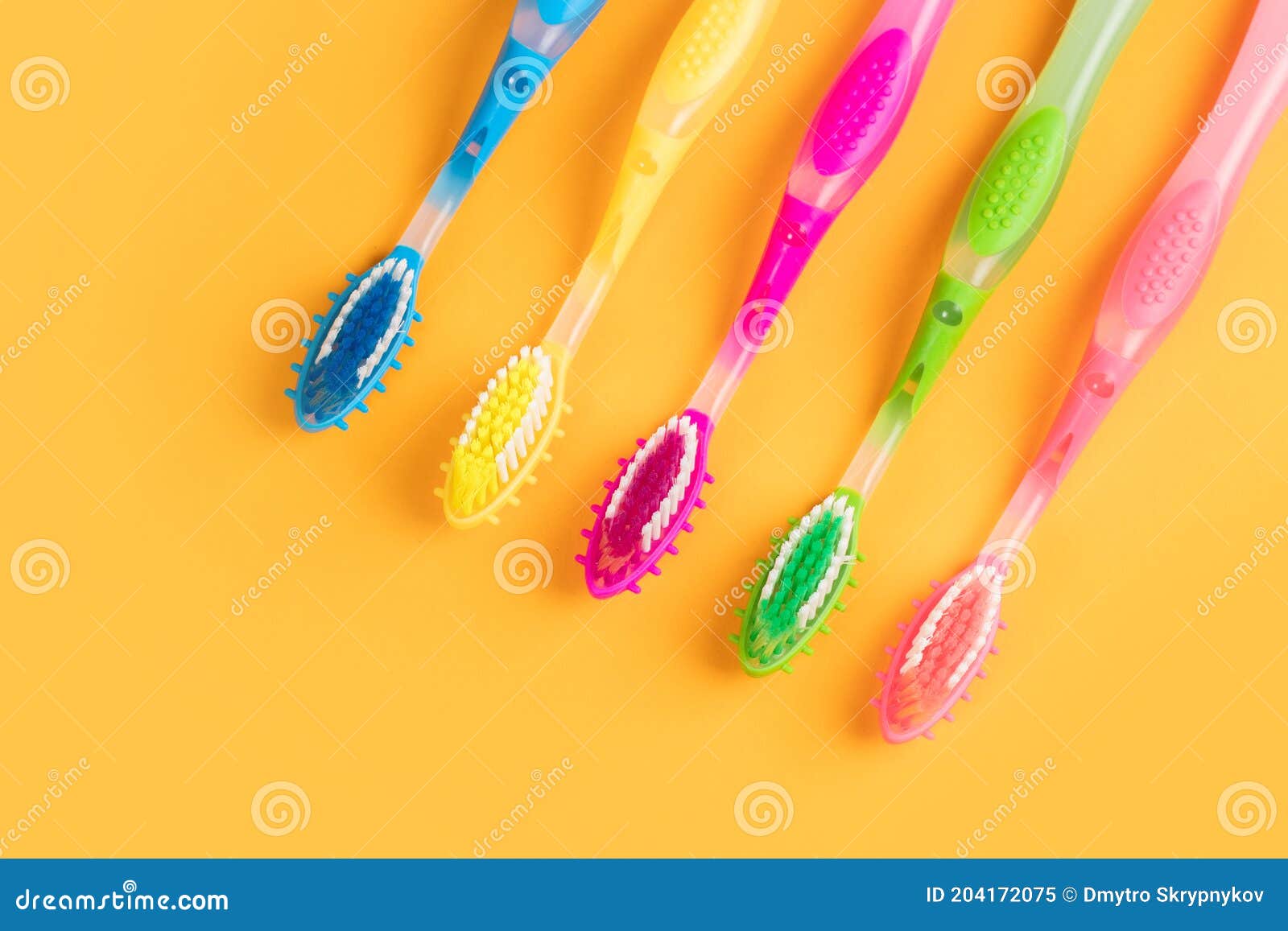 Colorful Toothbrushes on Yellow Background Stock Image Image of
