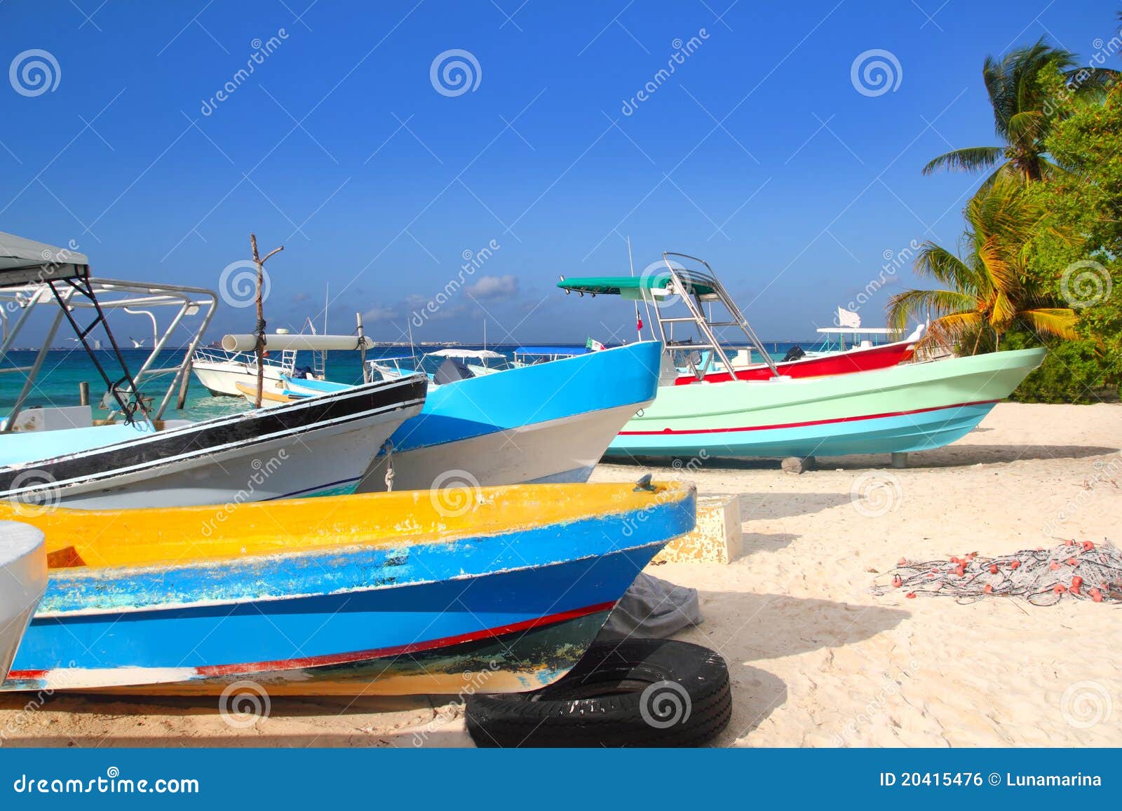 colorful tropical boats beached in sand royalty free stock