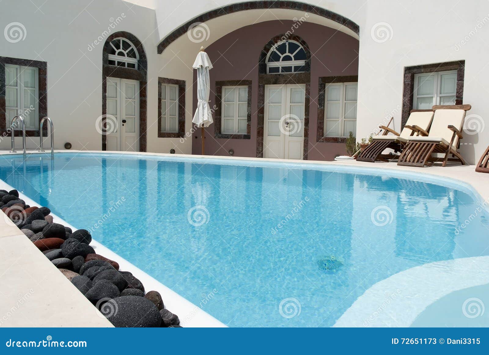 colorful volcanic stones next to a swimming pool