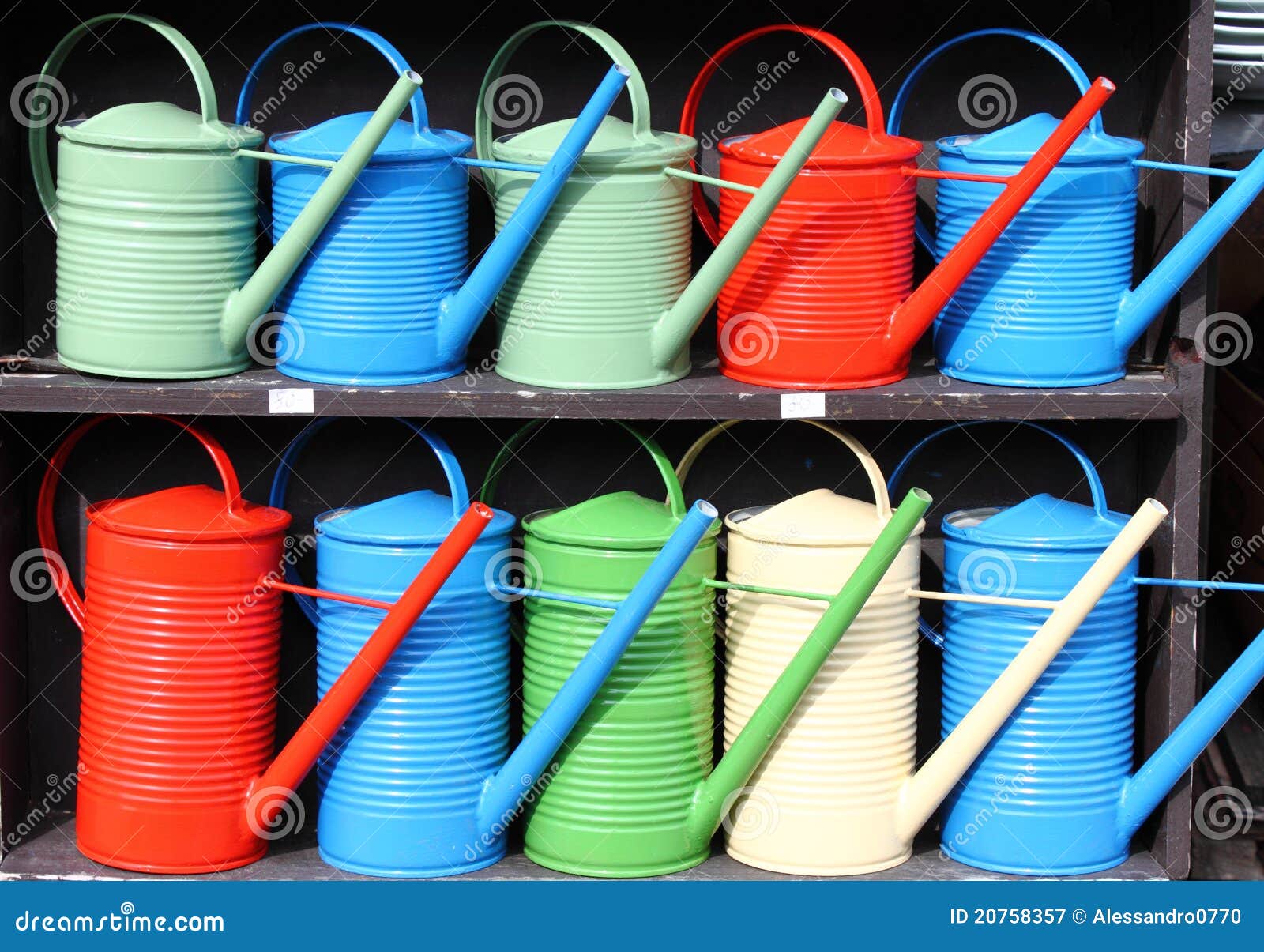 Colorful watering cans stock image. Image of sell, giving 20758357