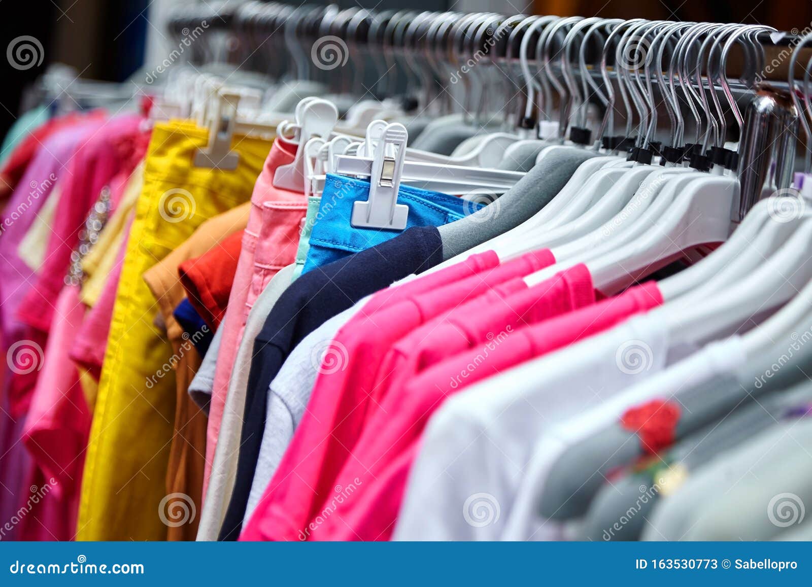 Colorful Femalesummer Pants and T-shirts on Hangers in a Retail Shop ...