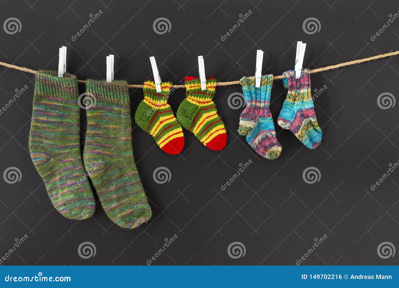 Colorful Woolen Socks On A Rope On Black Background Stock Photo - Image ...