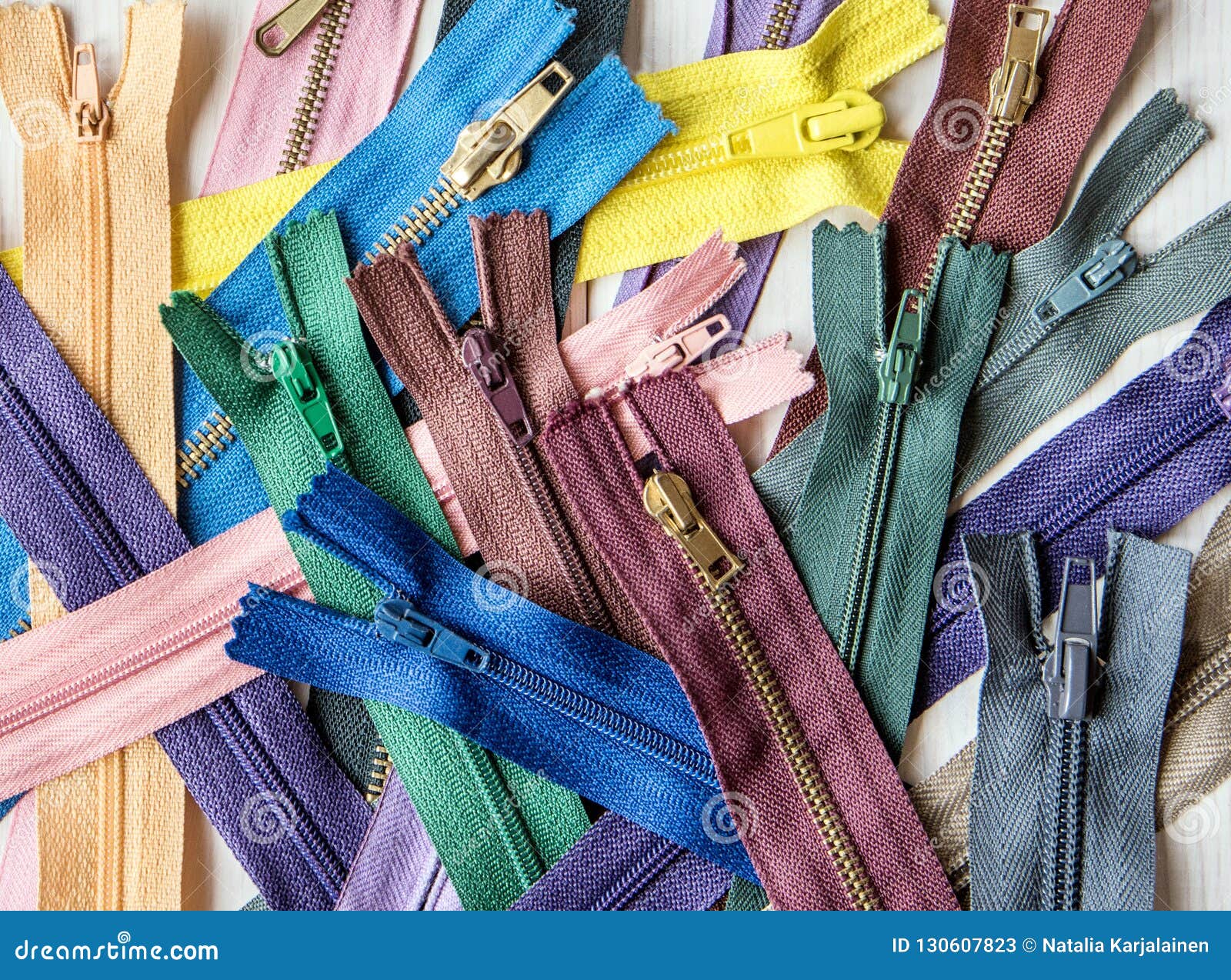 Colorful Zippers and Buttons on White Wooden Table. Rustic Style ...