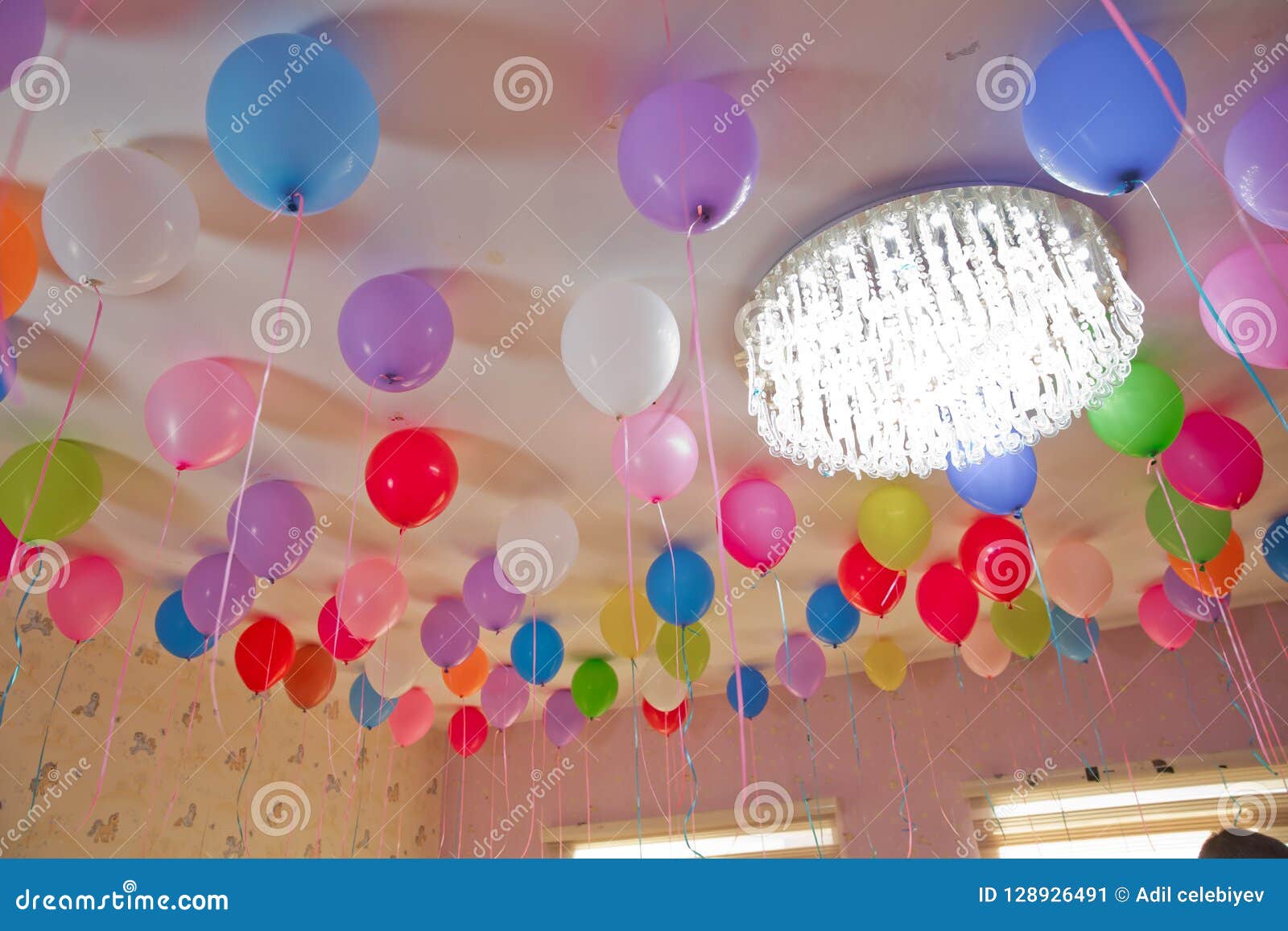 Colorfull Balloons Float On The White Ceiling In The Room