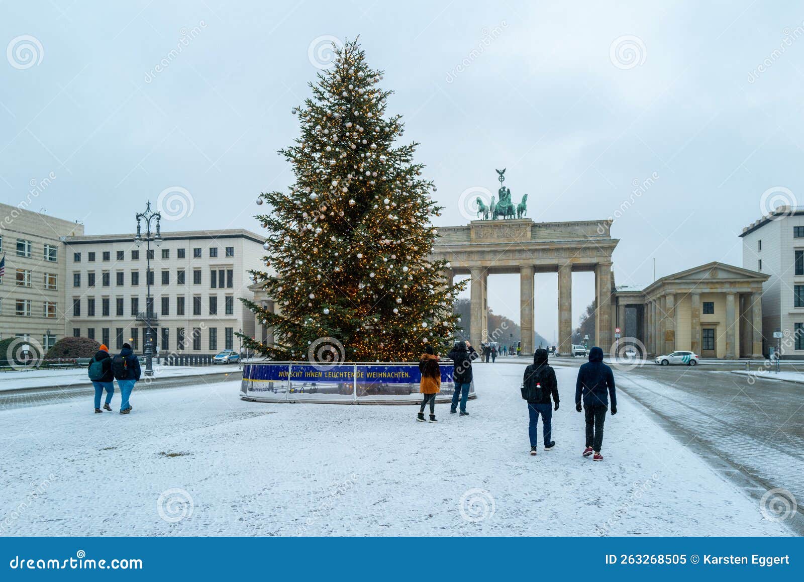 A Colorfully Decorated Christmas Tree Stands in Front of the