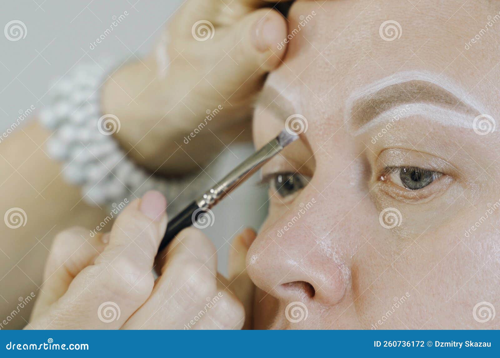 Coloring with White Lines of the Shape of the Eyebrows on the Face