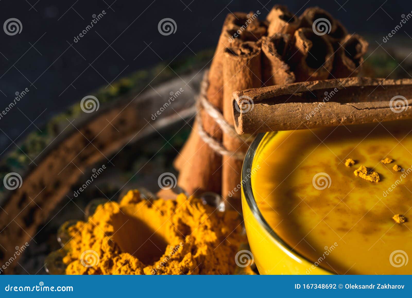 Golden Turmeric Milk on the Dark Background with Spices Cinnamon and ...