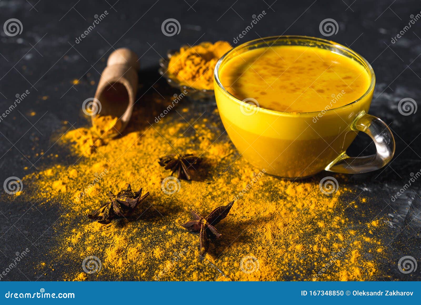Golden Turmeric Milk on the Dark Background with Spices Cinnamon and ...