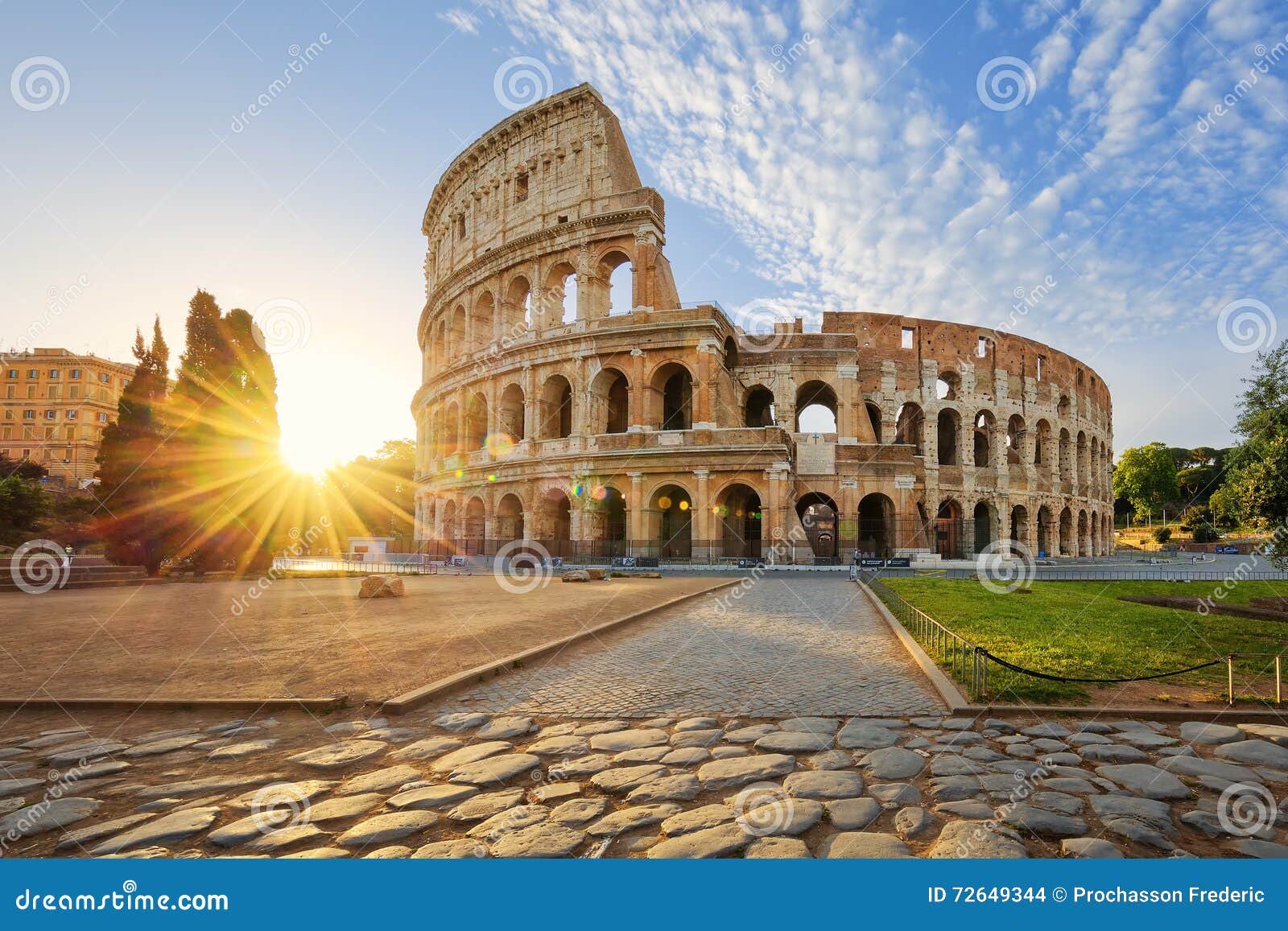 colosseum in rome and morning sun, italy