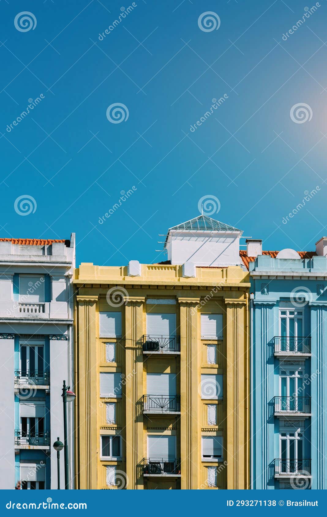 colourful building facades in campo pequeno, lisbon, portugal on a sunny day