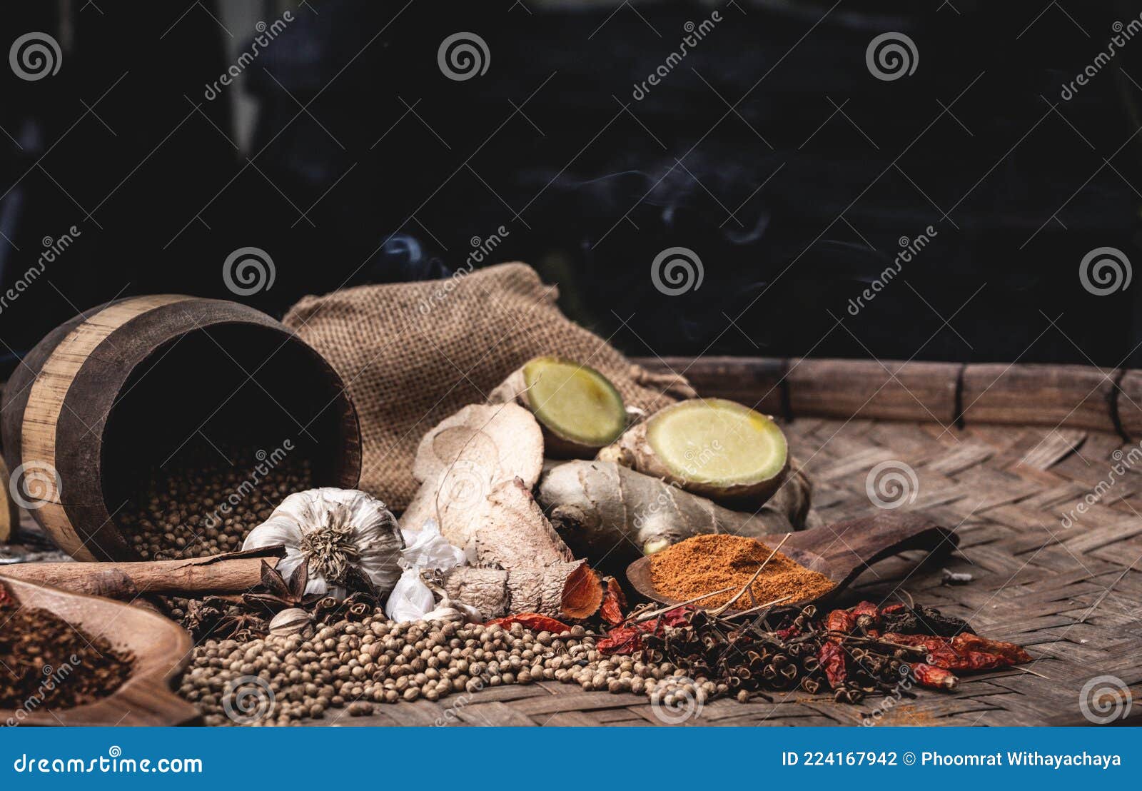 colourful spices in wooden tray. asian popular cooking ingredients, dry hot healthy cook herbs. view form above and copy space