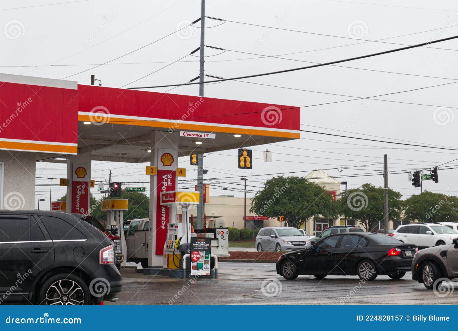 Circle K Gas Station Panic Lines at the Pump in the Rain Editorial