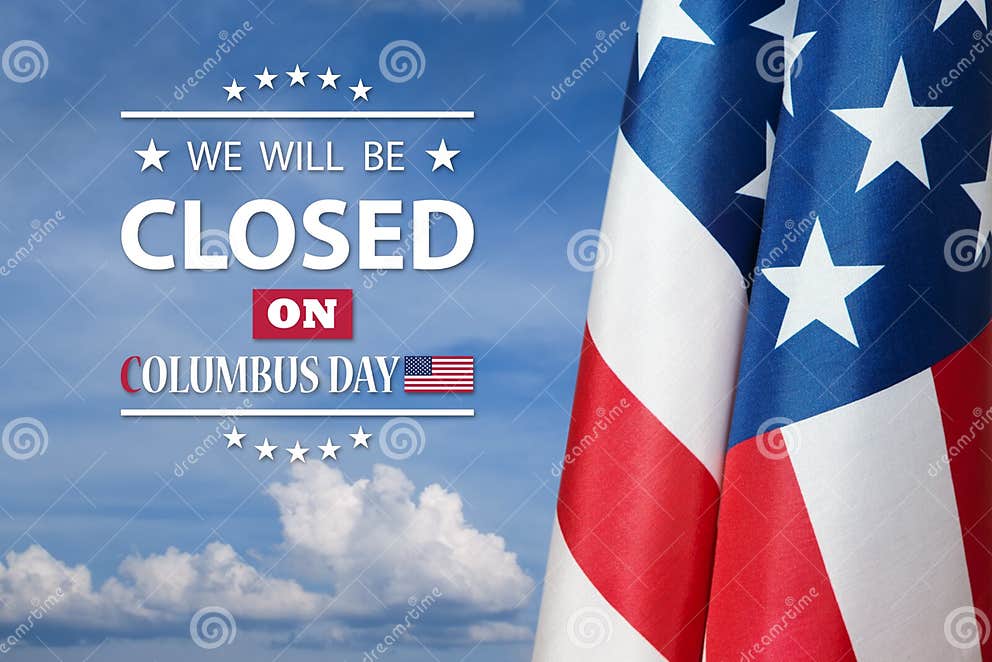 American Flag on Background of Blue Sky with a Message. we Will Be Closed on Columbus Day Stock