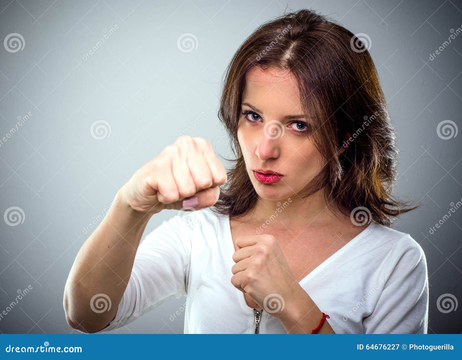 Combative Young Woman Punching at the Camera Stock Image Image of