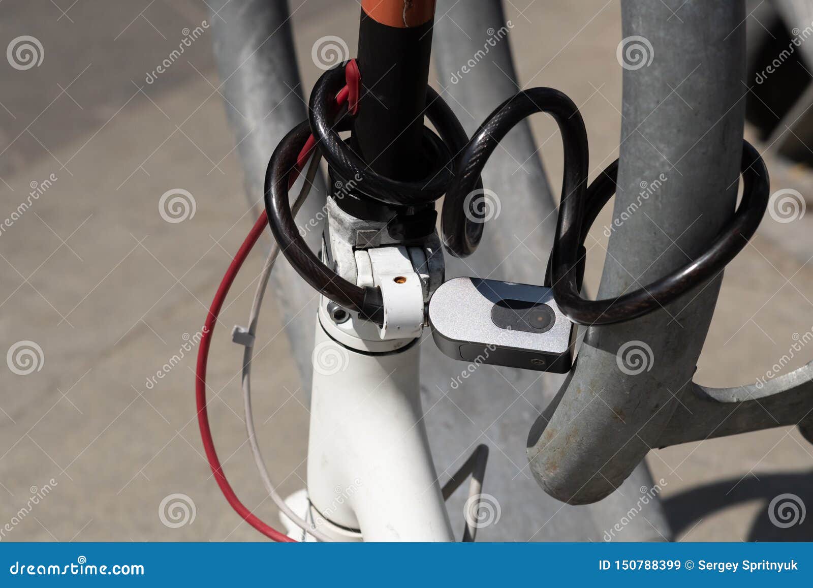 Combination Security Lock Blocking the Motor Scooter Wheel Stock Image