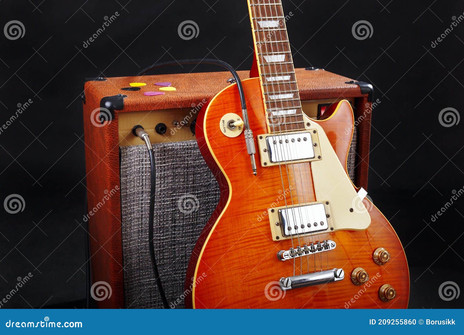 Combo Amplifier for Guitar with Guitar on Black Background Stock Photo
