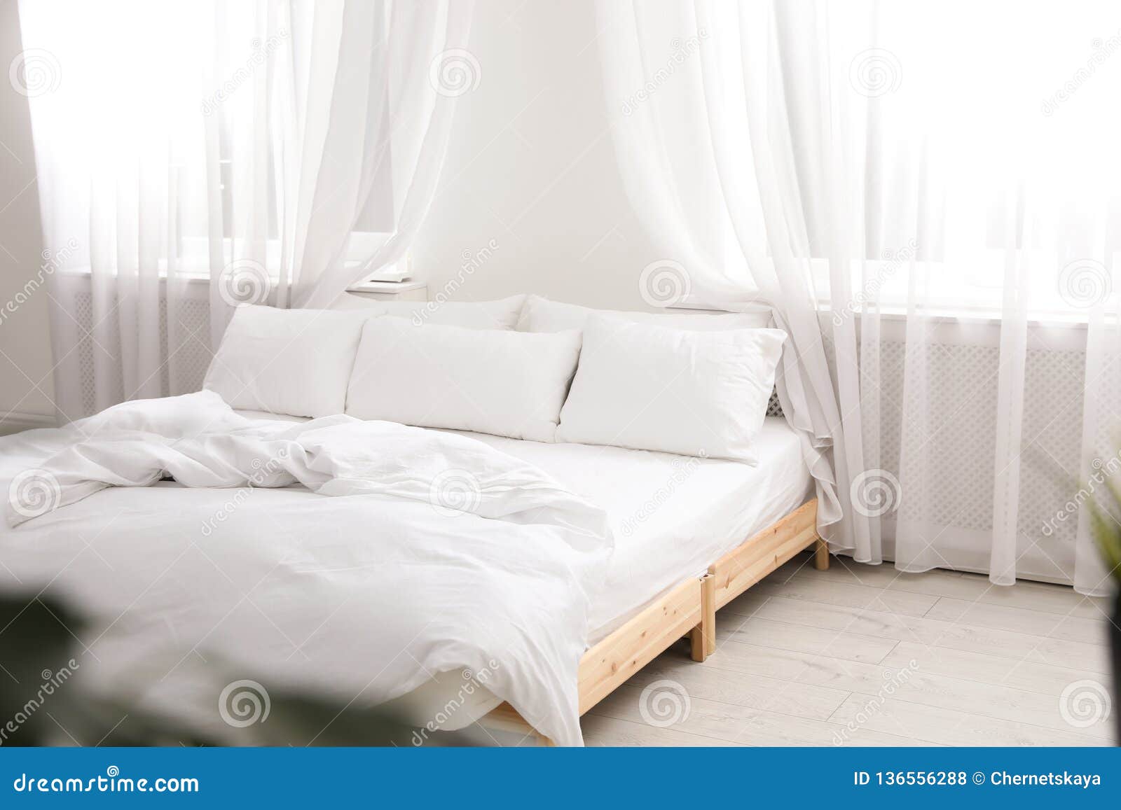 Comfortable Bed in Light Room. Interior Stock Photo Image of