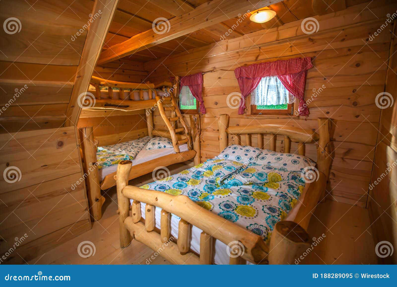 comfortable  bedroom accommodation in a log cabin at hija glamping lake bloke, nova vas, slovenia