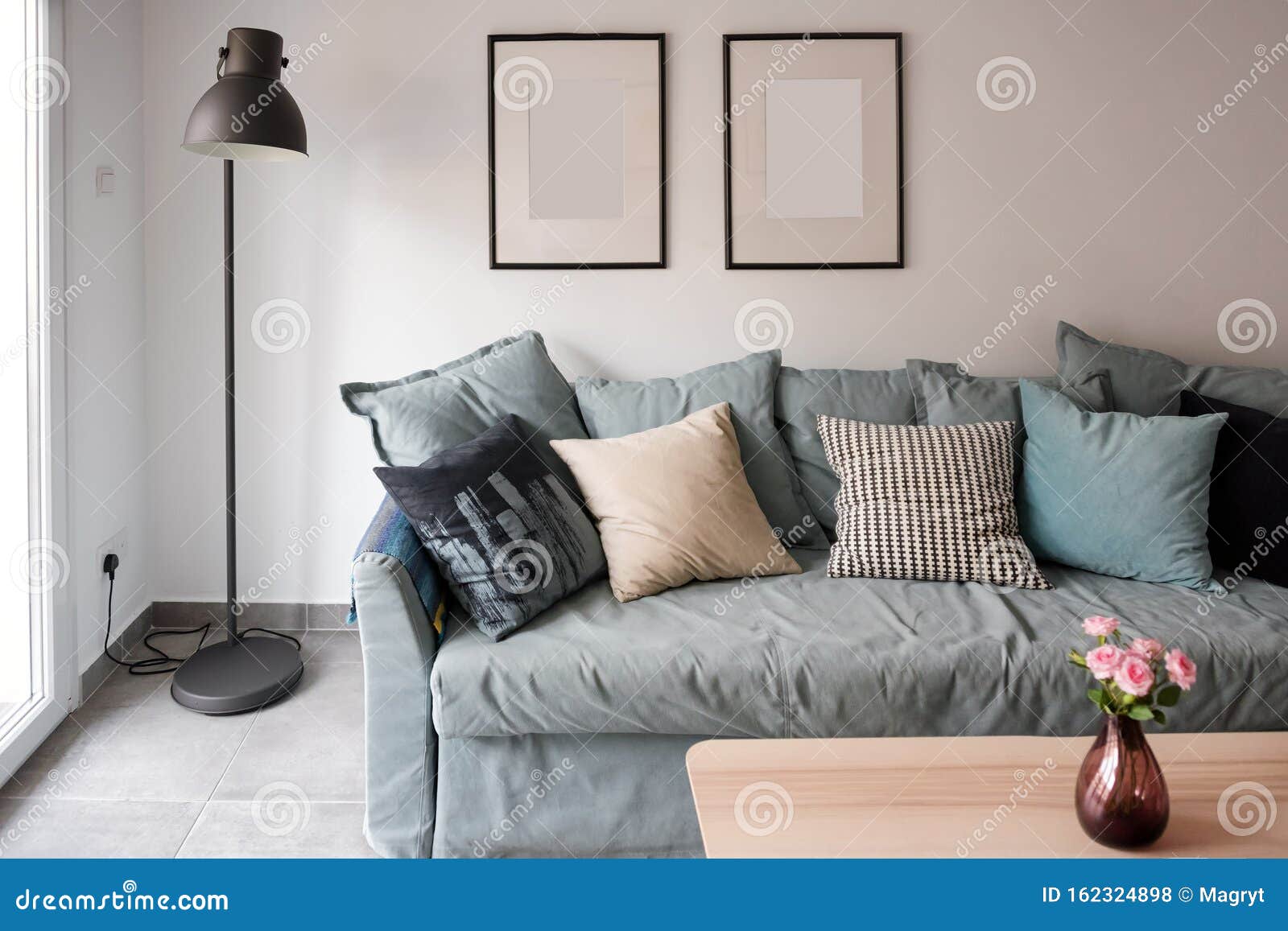 blue couch with pillows