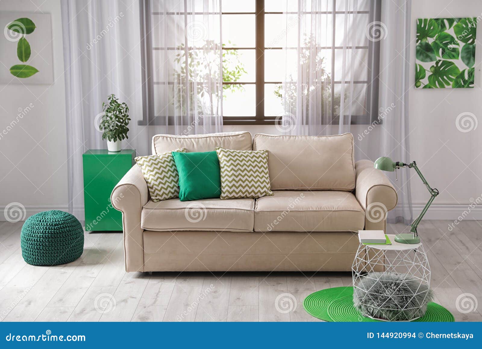 Comfortable Couch Near Window in Modern Room Interior Stock Photo