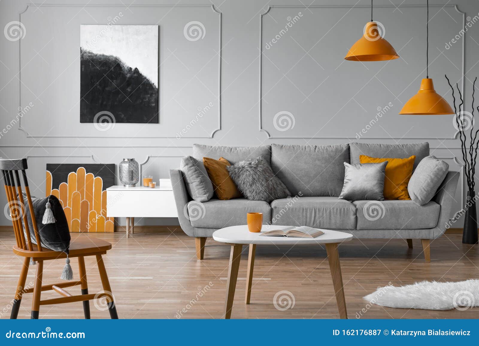 grey sofa with pillows