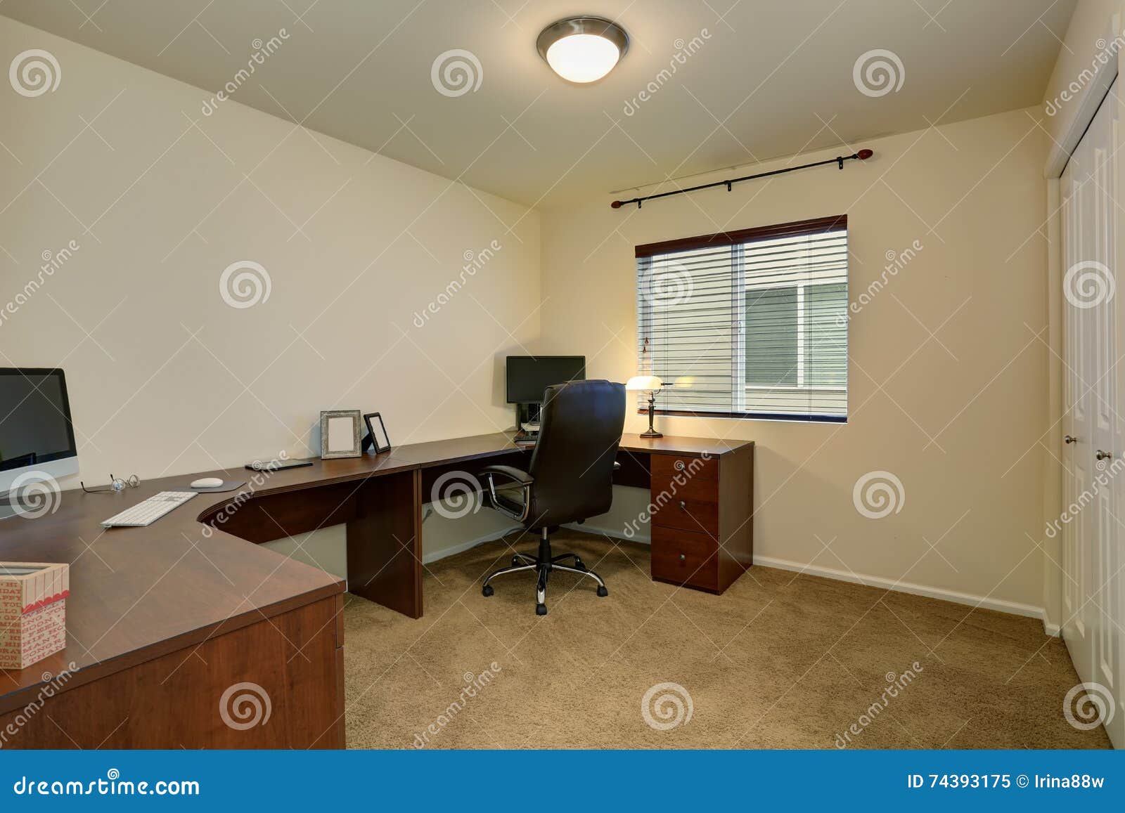 Comfortable Home Office Interior with Large Brown Desk and Carpet Floor
