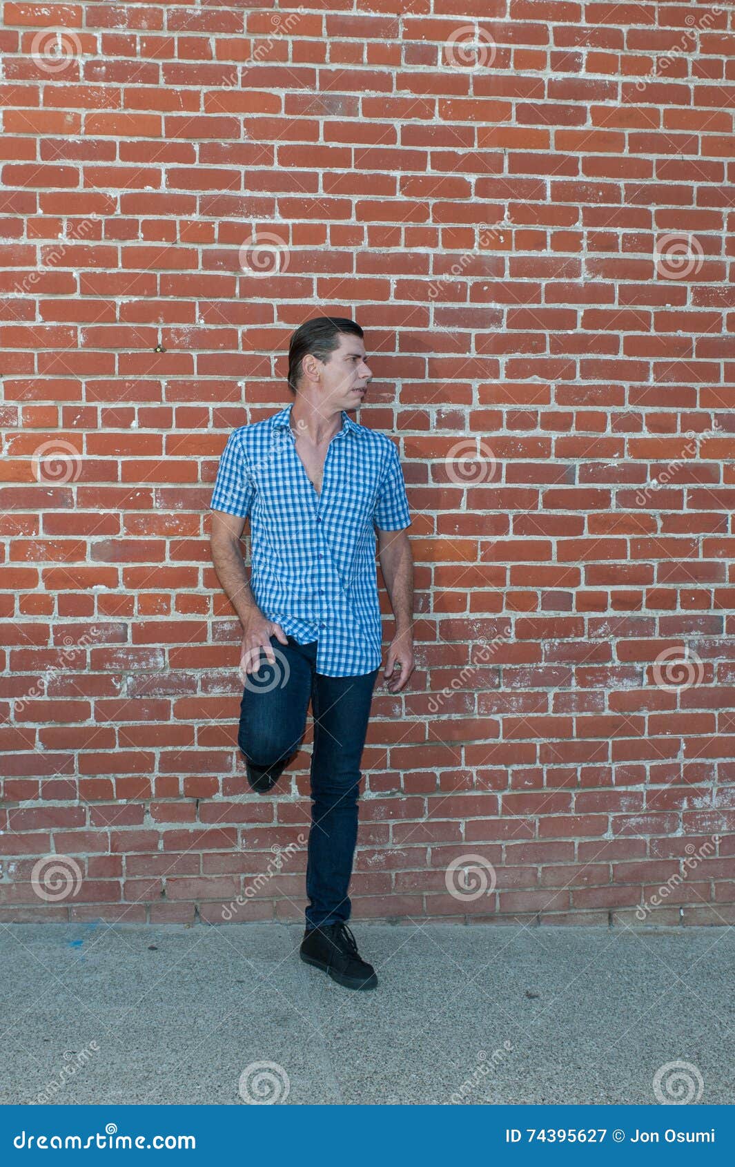 Comfortable Leaning Against the Wall. Stock Image - Image of standing ...
