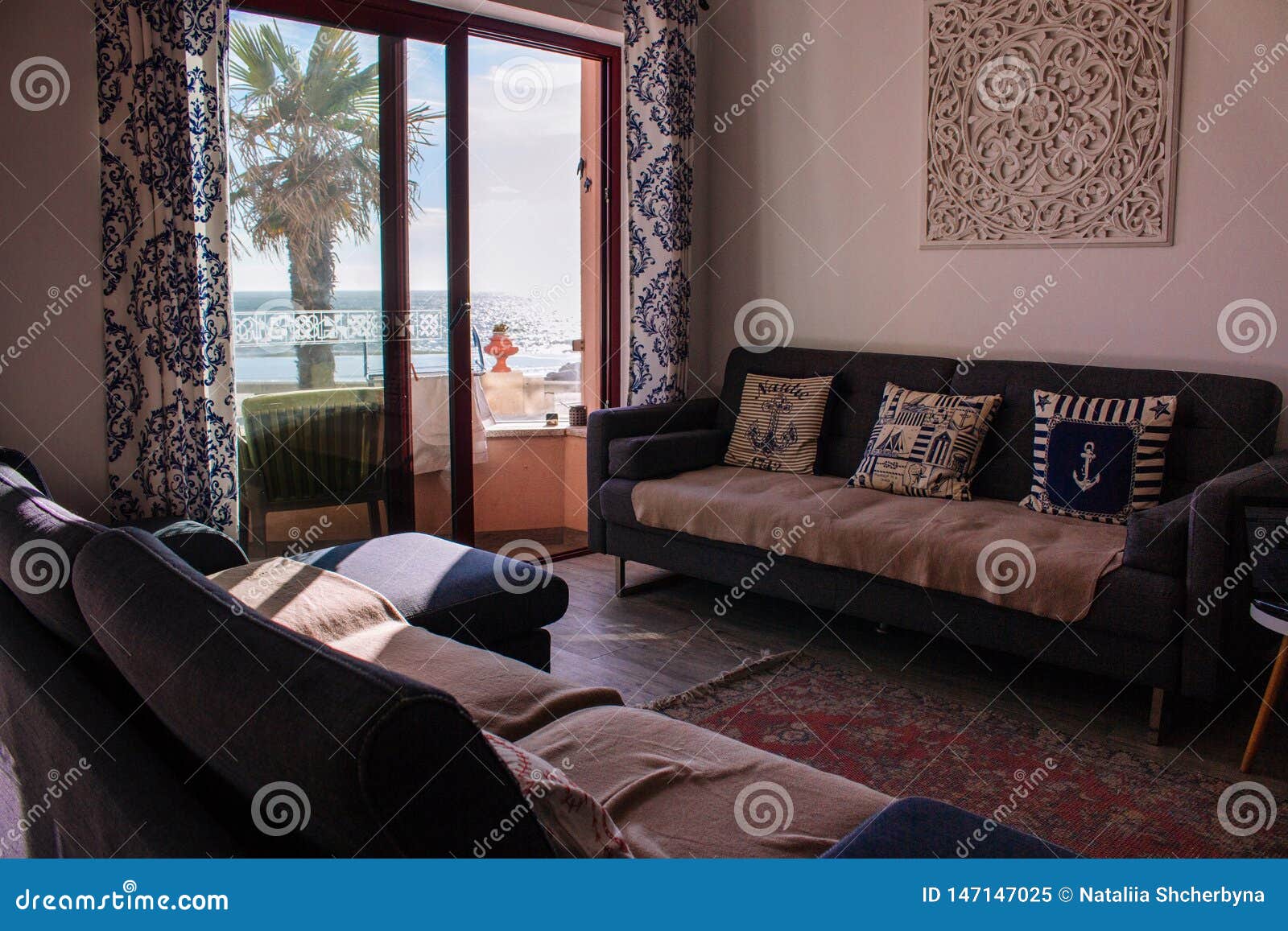 Comfortable Room With Sofa And Balcony With Sea View Cozy Interior Of Apartment Living Room With Stylish Decor And Furniture Stock Image Image Of Cozy