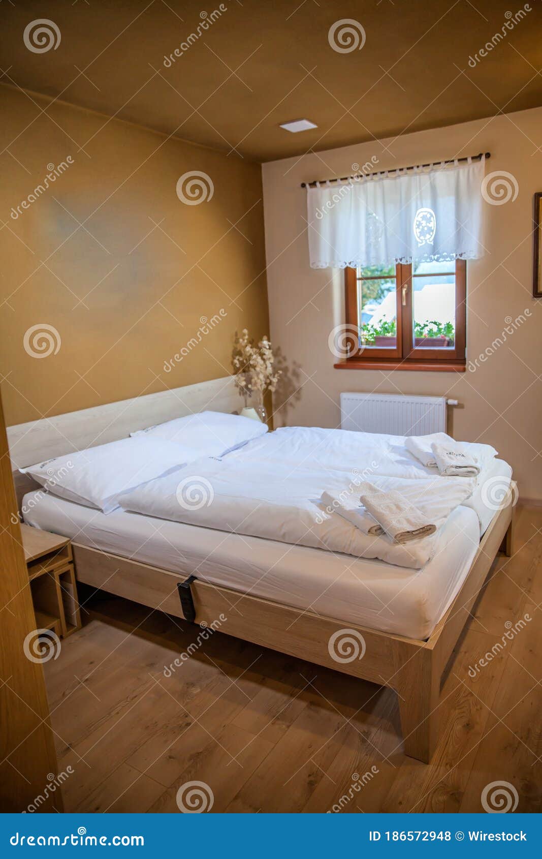 Comfortable Rustic Hotel Room with White Bed Linen at a Nature Park Stock Photo Image of