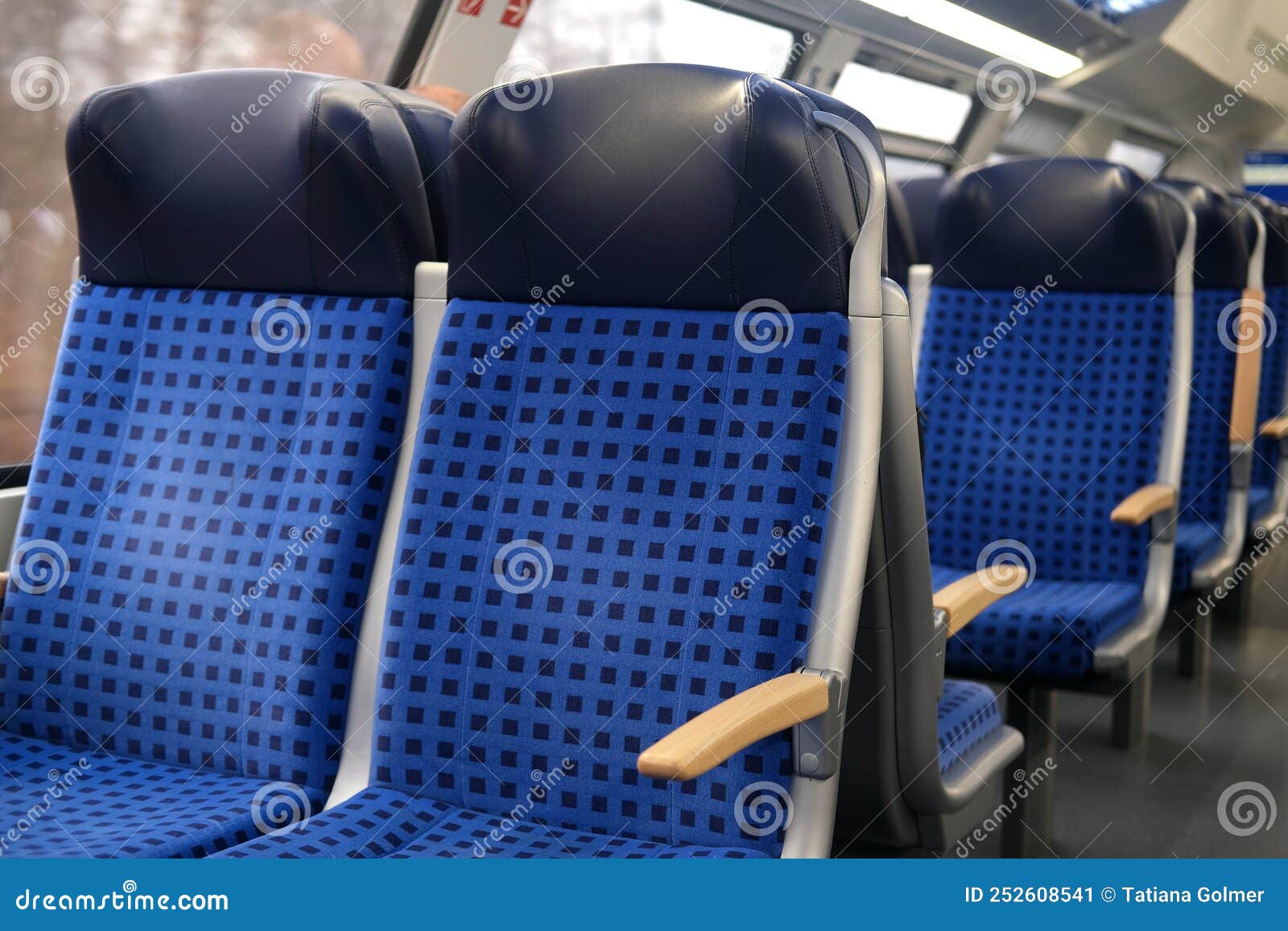 Comfortable Soft Blue Seats with Headrests in a Train Car in Germany