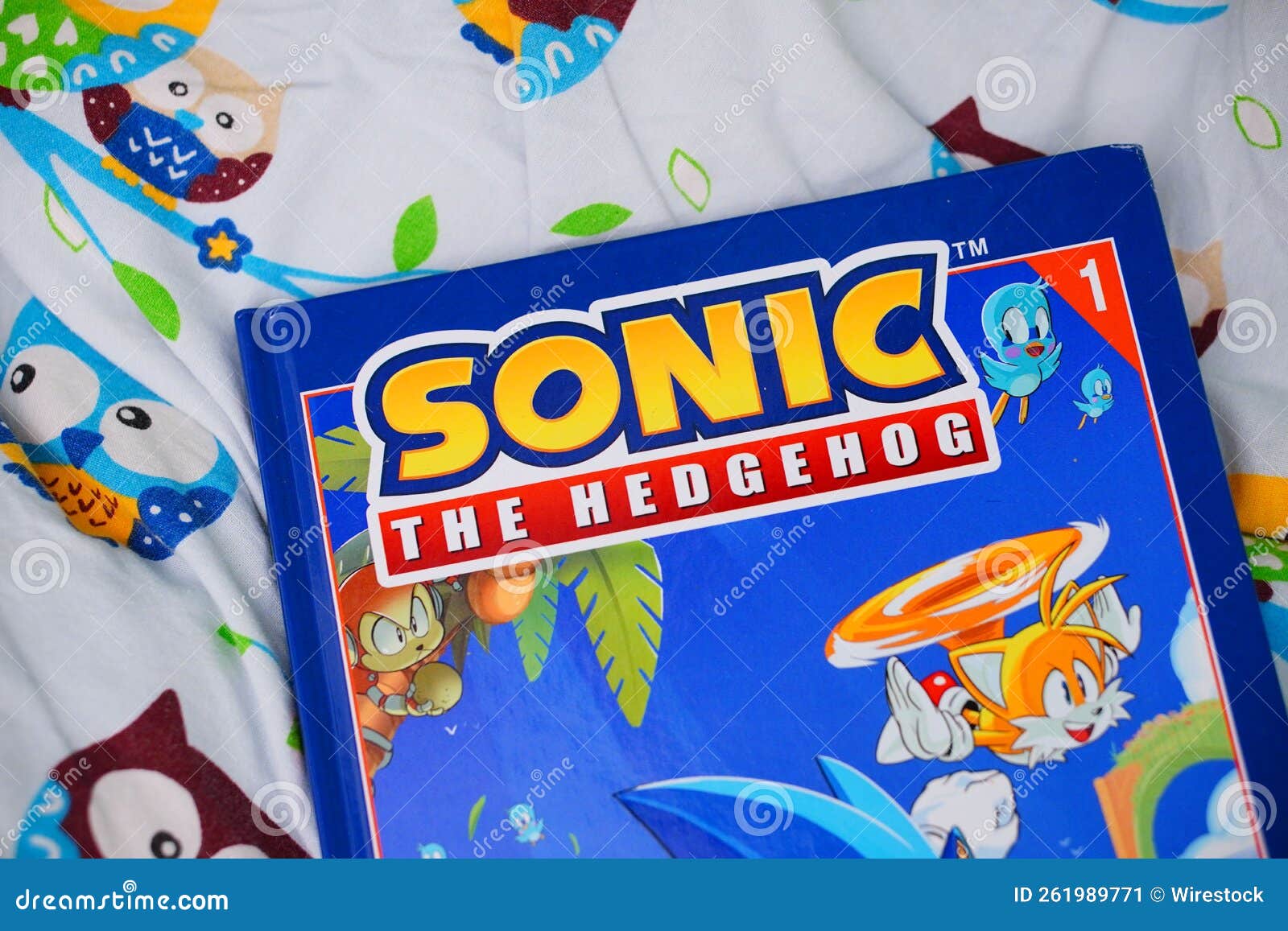 Comic Book of Sonic the Hedgehog Laying on a Sheet Editorial Photo