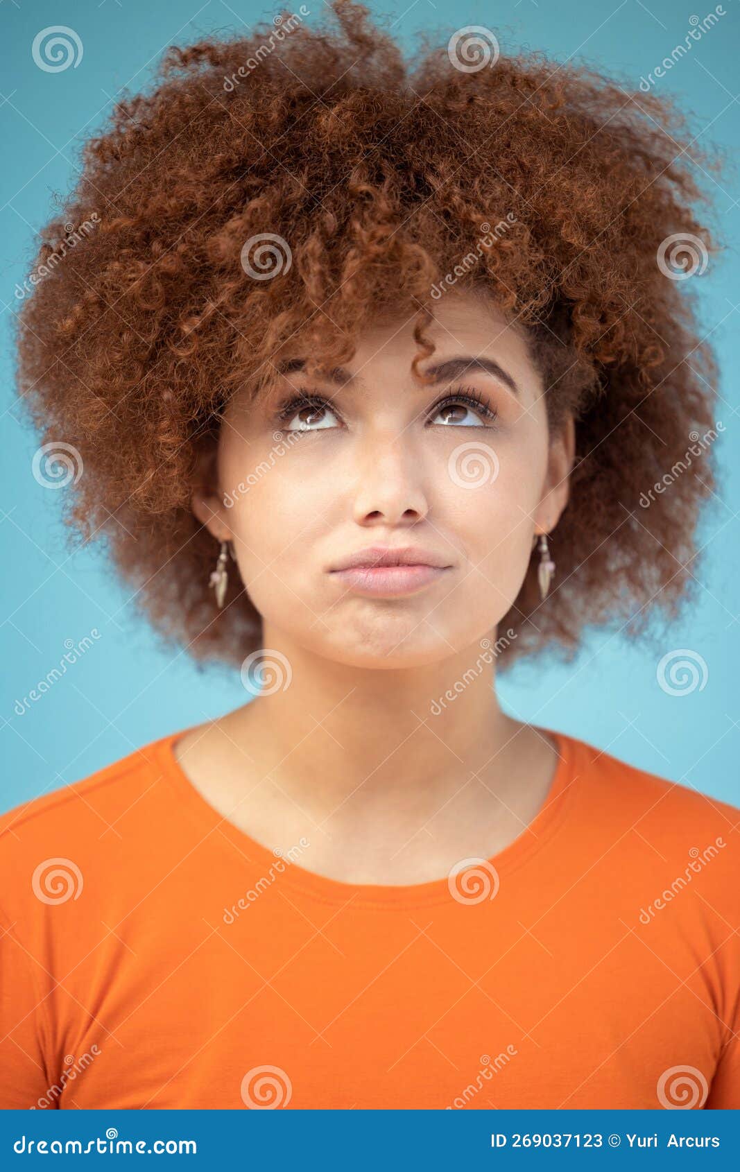 Comic, thinking and face of woman on blue background with ideas, vision and looking up in studio. Fashion mockup, thoughtful and emoji facial expression of confused girl with attitude and mindset.