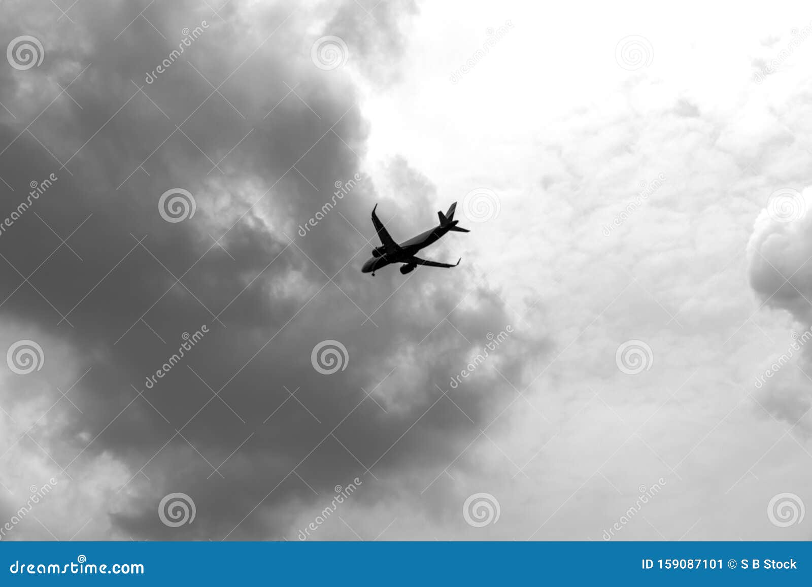 commercial airplane flying in the dramatic clouds. civil aviation traffic travel concept. aircraft point of view