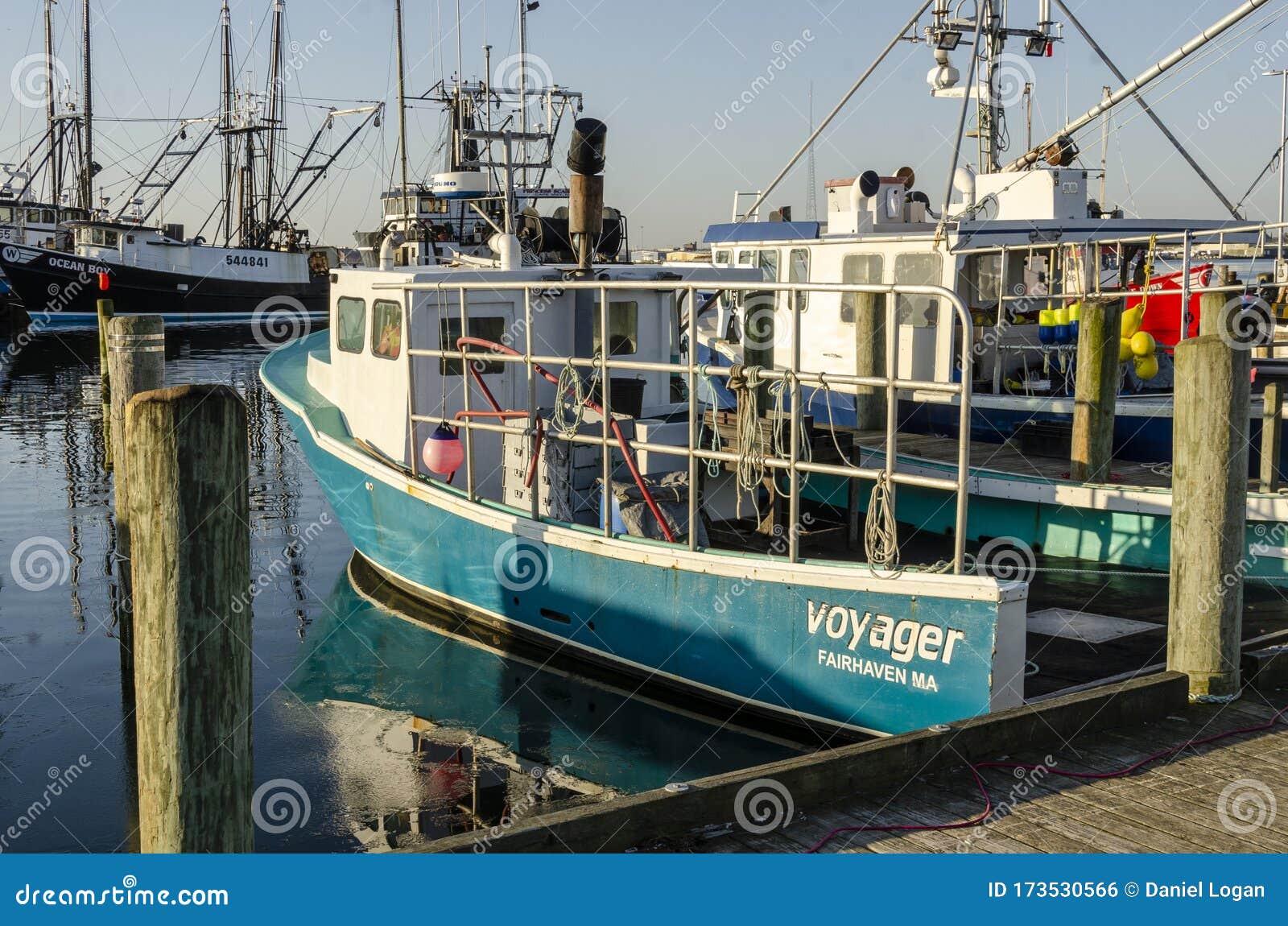 Commercial Fishing Boat Voyager Reflected In Skim Of Ice Near Docks Editorial Photo - Image of ...