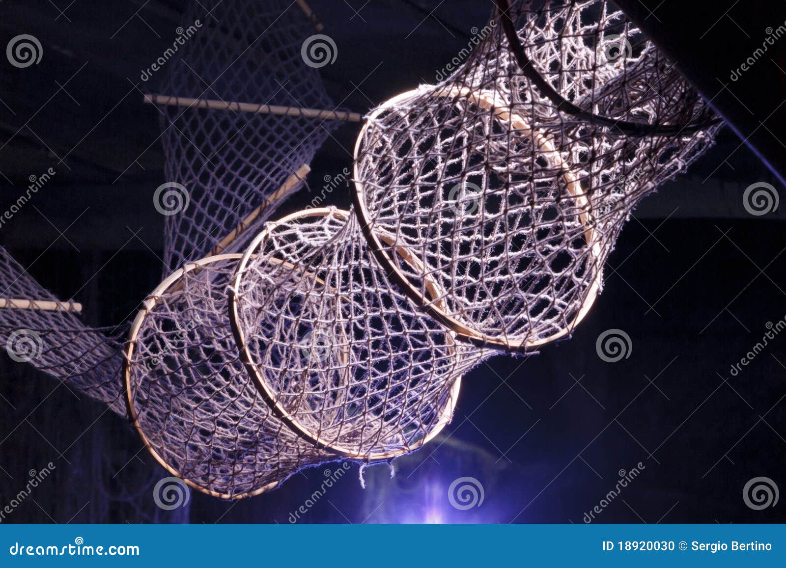 Commercial fishing net. Sun shining on a commercial hooped fishing net.